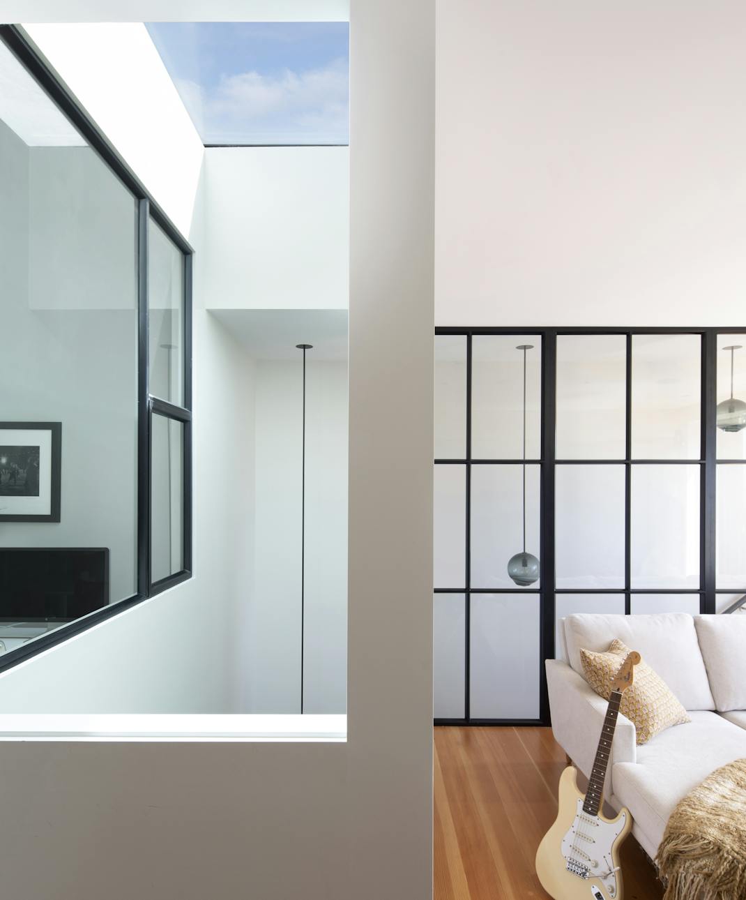 Andrew-Mann-Architecture-California-Historic-Cottage-Row-Skylight-view from-Lounge