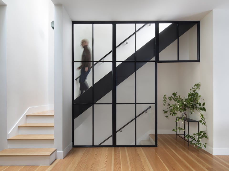 Andrew-Mann-Architecture-California-Historic-Cottage-Row-Staircase-with-Man