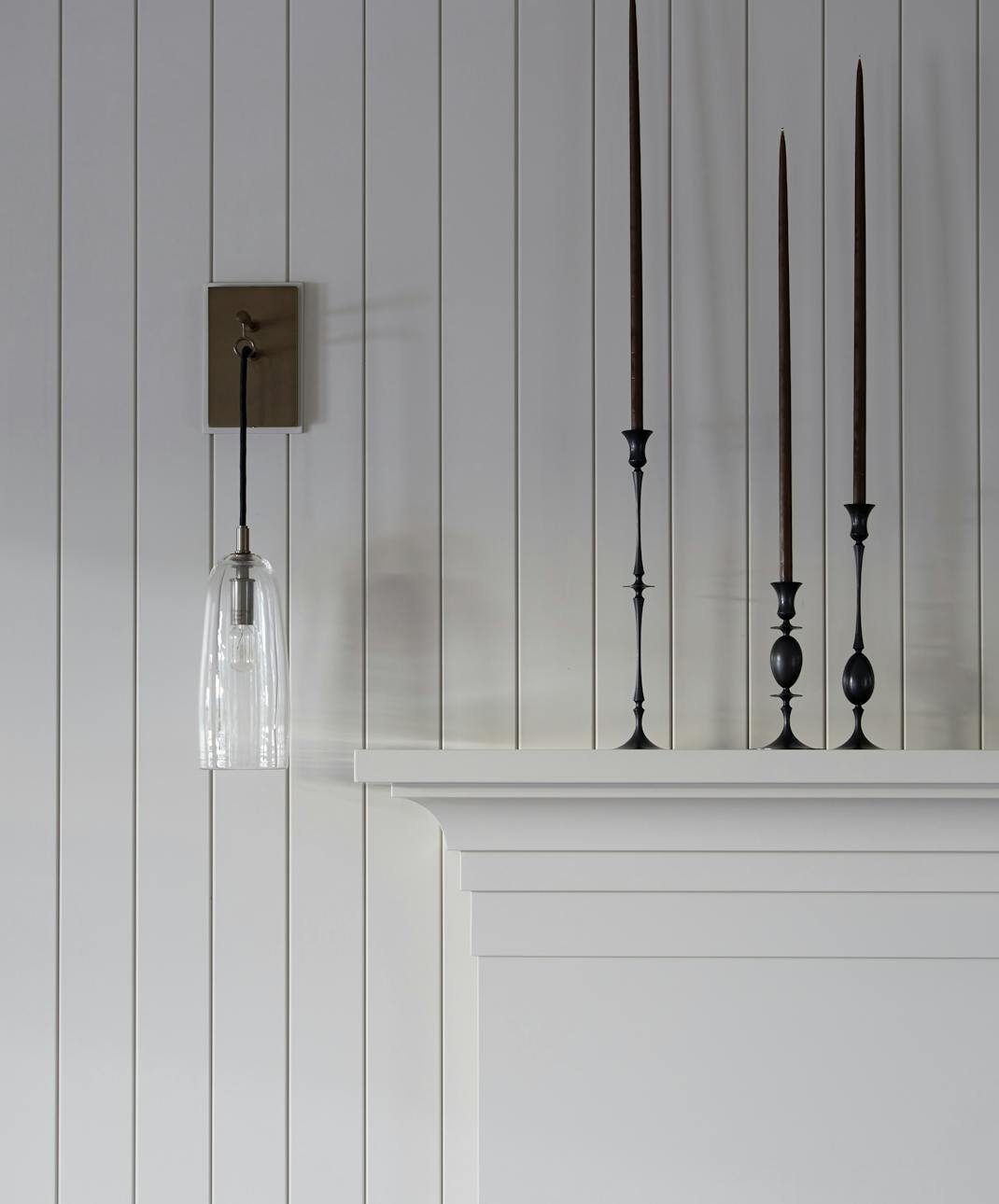 Andrew-Mann-Architecture-California-Wine-Country-Mantelpiece-with-Black-Candle-stands
