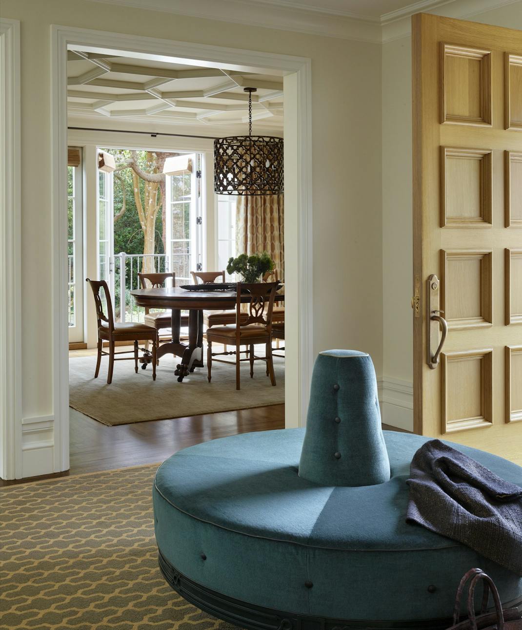 Andrew-Mann-Architecture-California-Spanish-Blue-Sofa-Foyer-looking-towards-Dining-Room