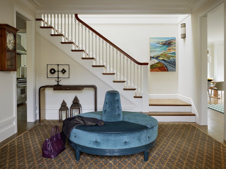 Andrew-Mann-Architecture-California-Spanish-Foyer-with-Blue-Sofa