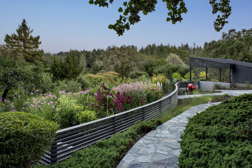 Andrew-Mann-Architecture-California-Sonoma-Retreat-Cabana-Pathway-Fence-with-Pink-Flowers