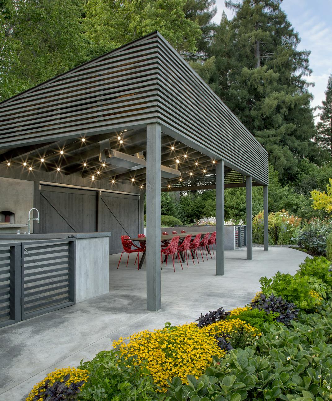 Andrew-Mann-Architecture-California-Sonoma-Retreat-Cabana-Side-View-with-Yellow-Flower-bed
