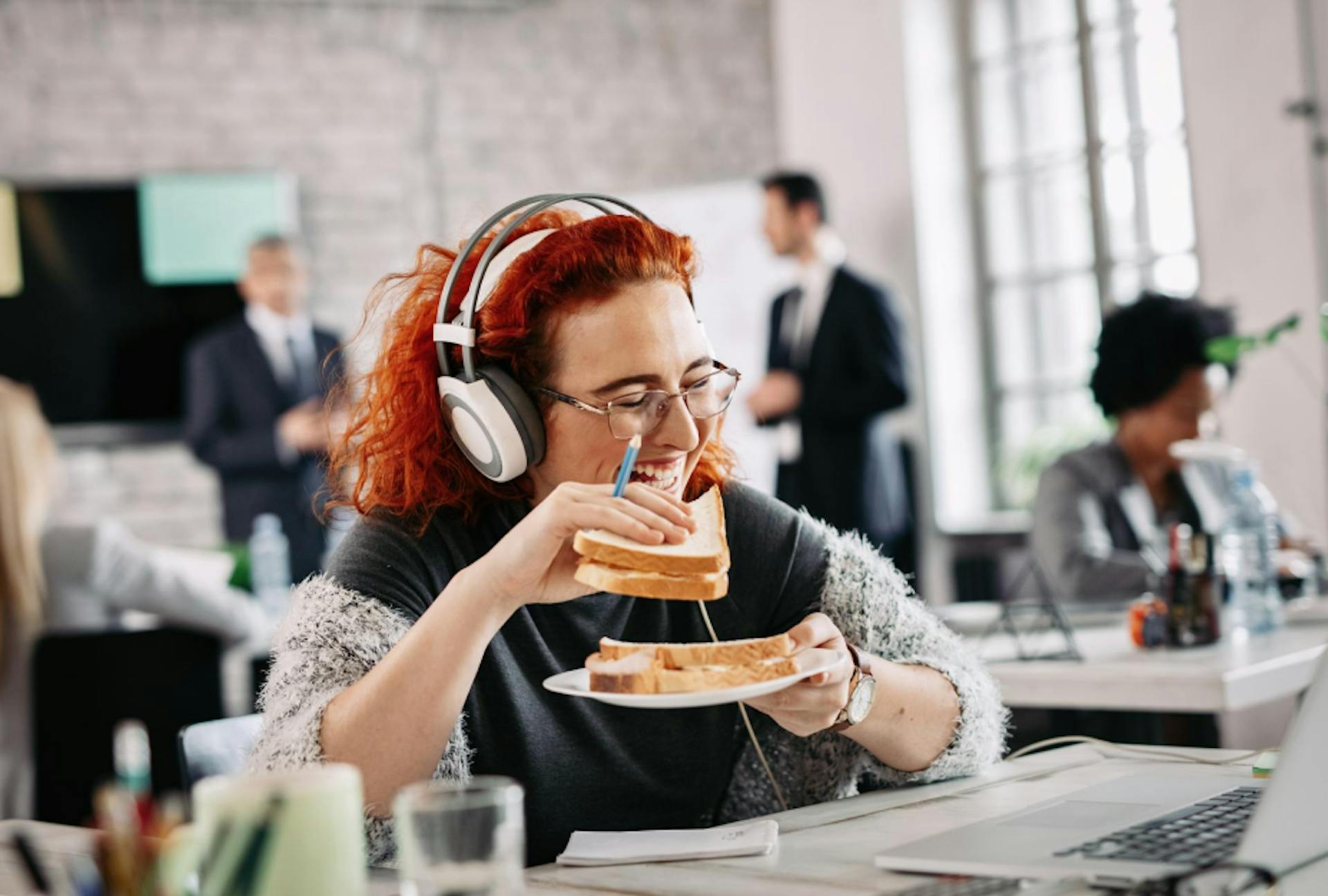 person enjoying sandwich