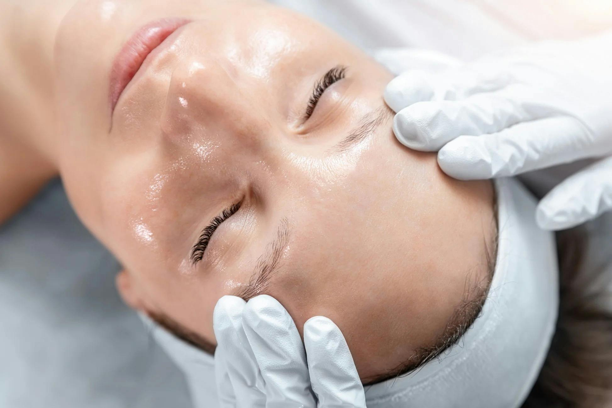 A female patient receiving professional peel facial treatment