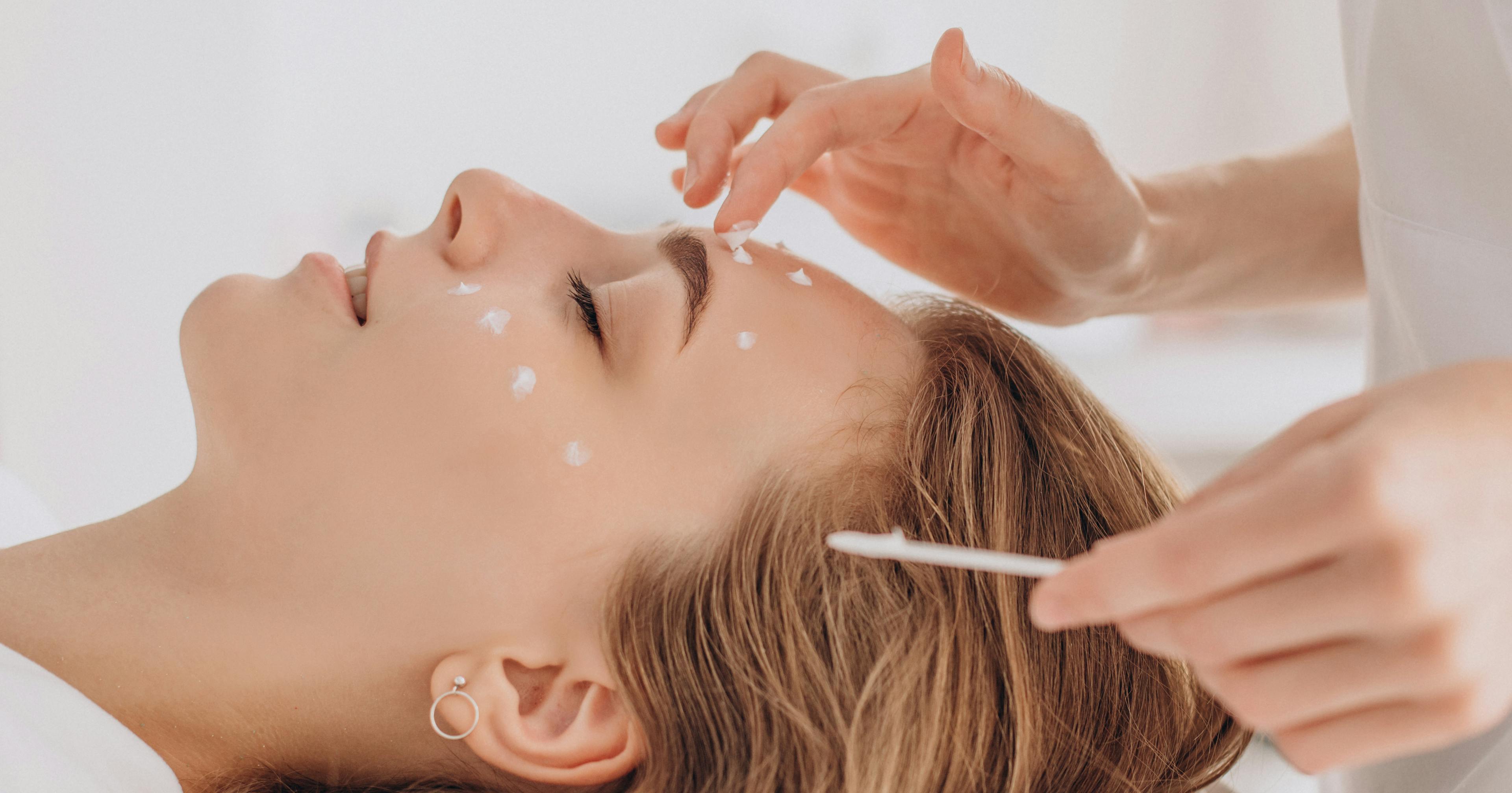 A female patient receiving a skin care treatment