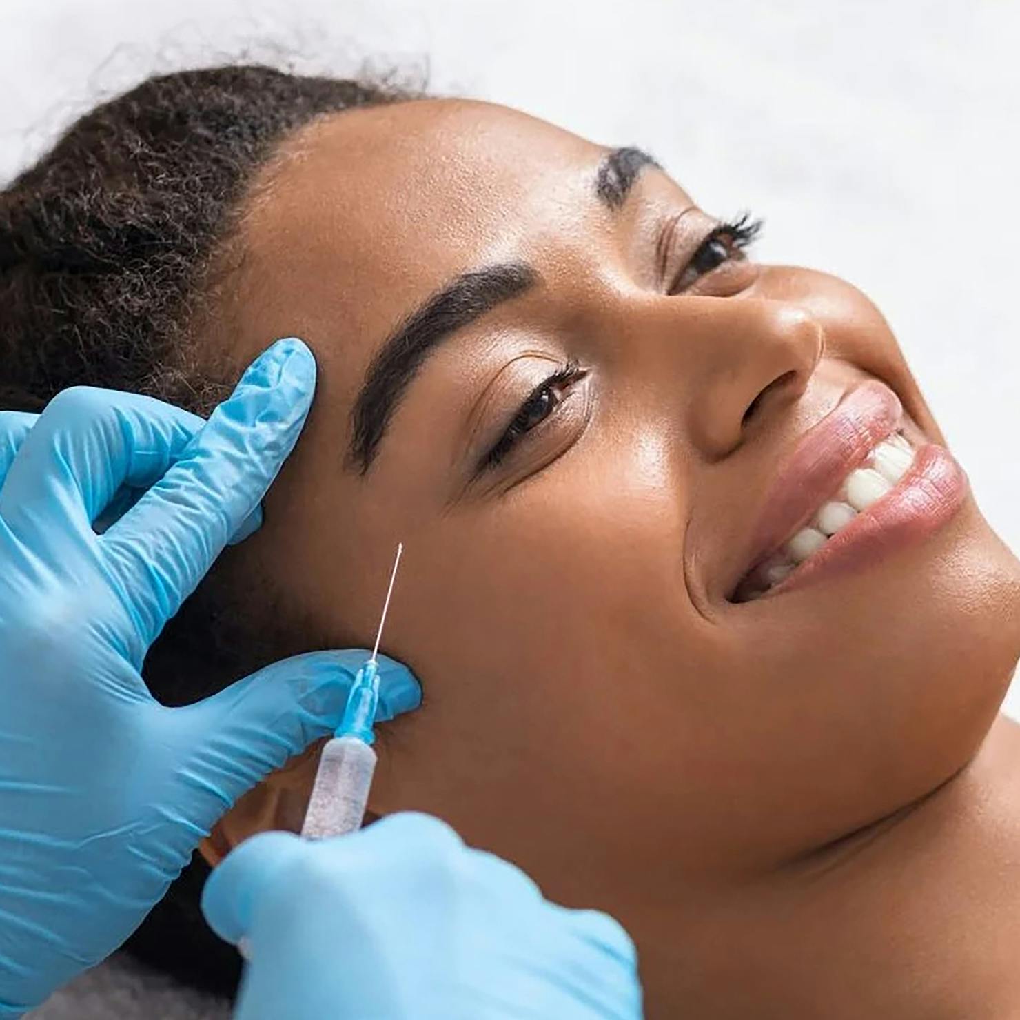A female patient receiving anti-wrinkle injection treatment