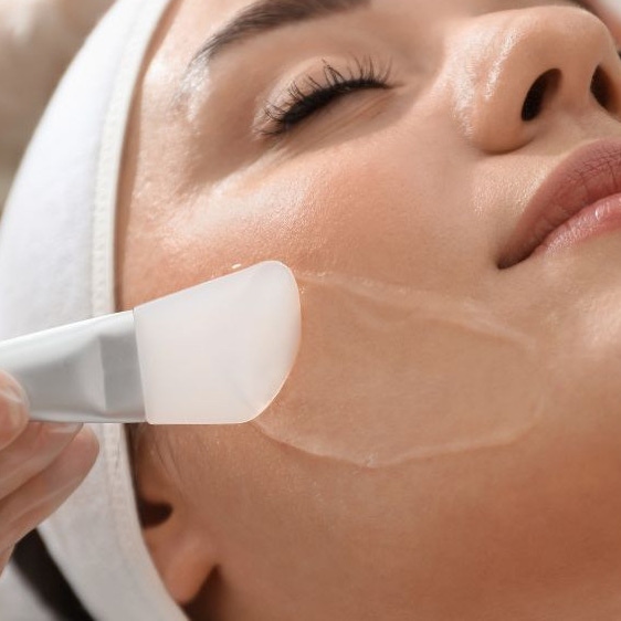 A female patient receiving professional peel treatment
