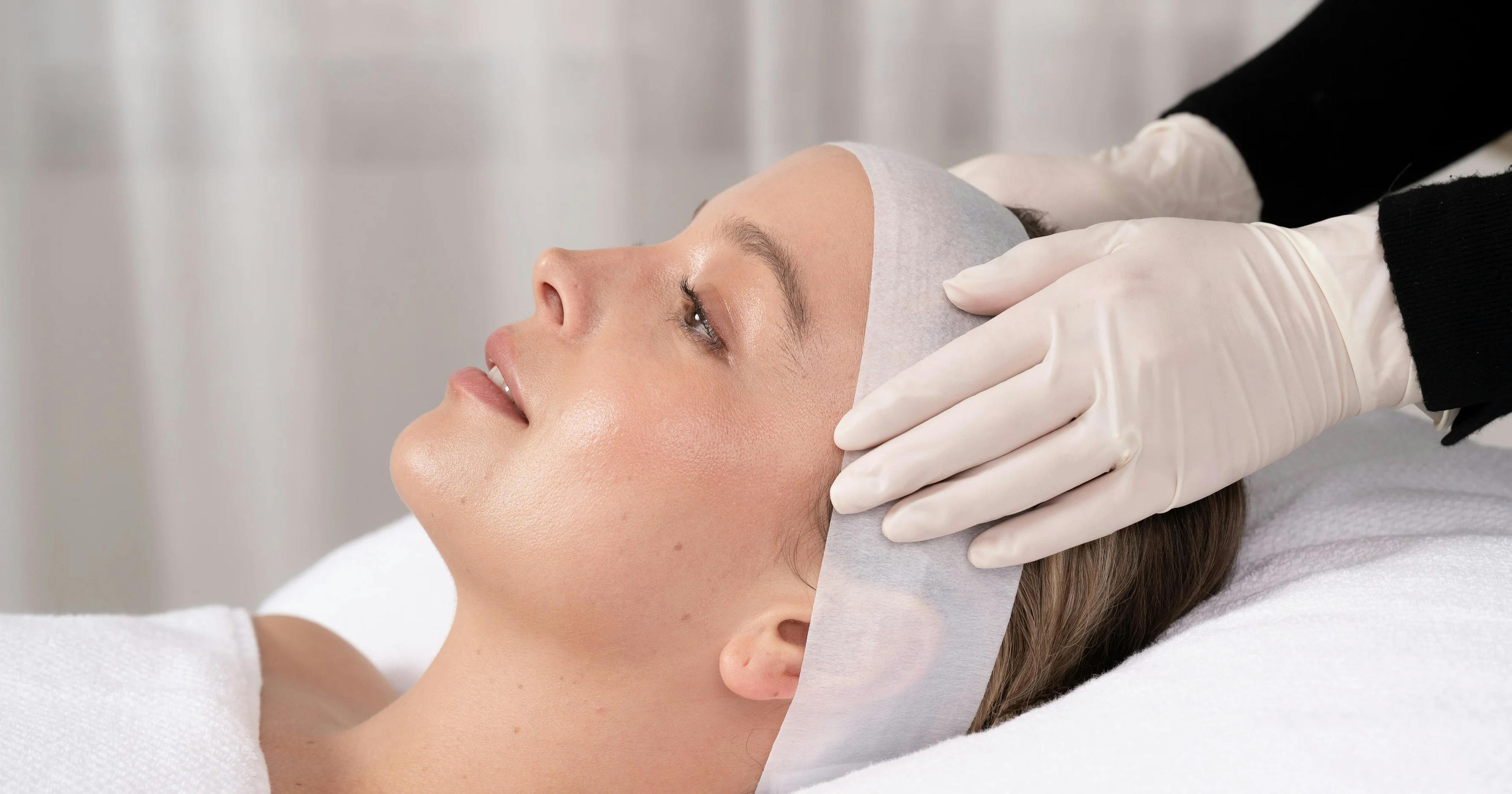 A female patient receiving bright and even peel