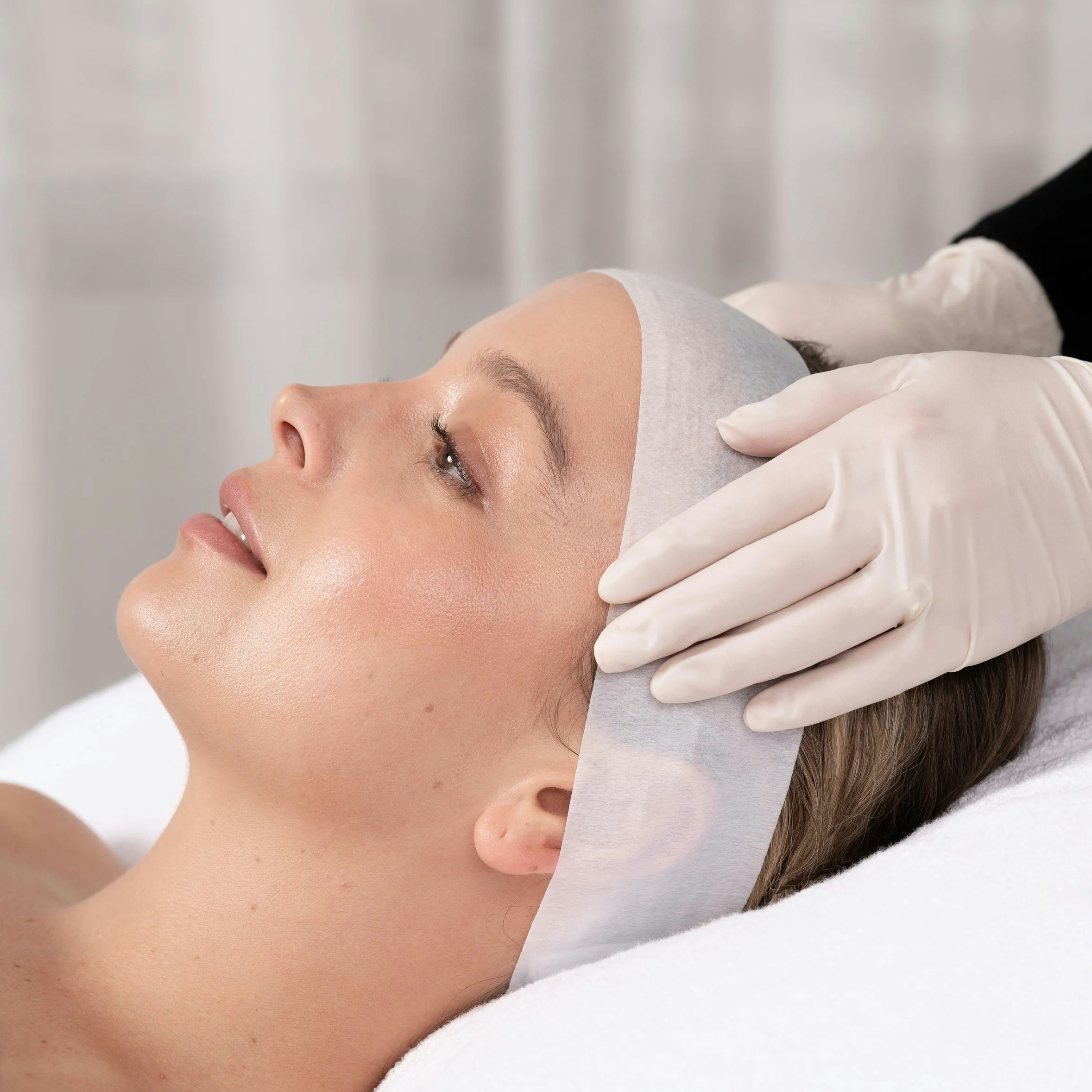 A female patient receiving bright and even peel