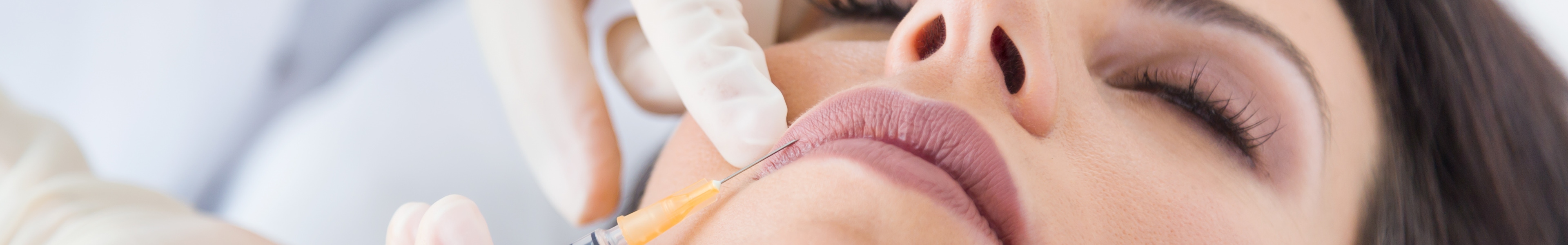A female patient receiving dermal filler treatment
