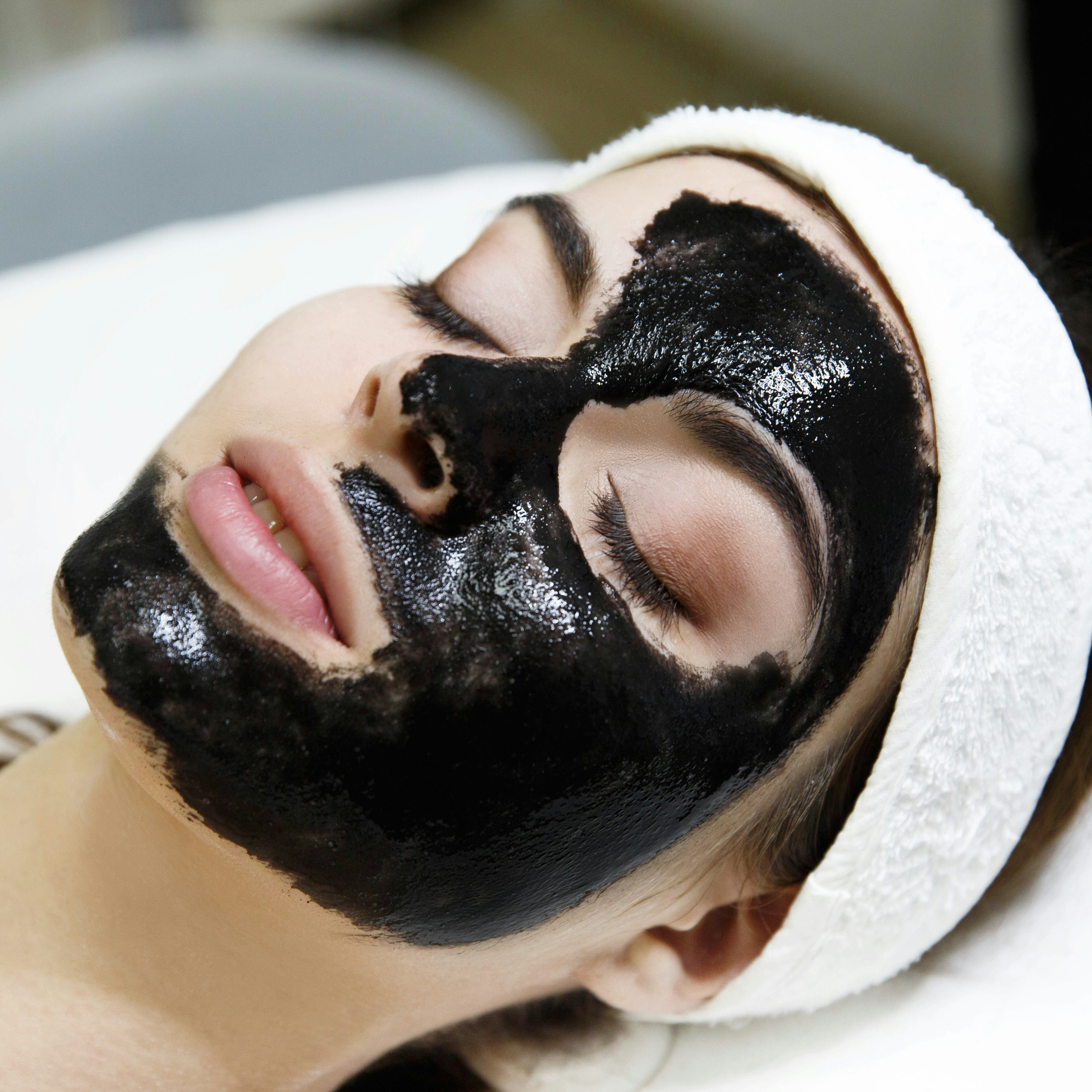 A female patient receiving deep detox facial treatment