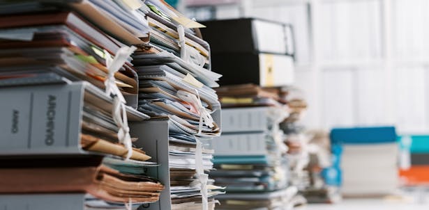 Piles of business records is a good sign you might need an accountant to make sense of it all
