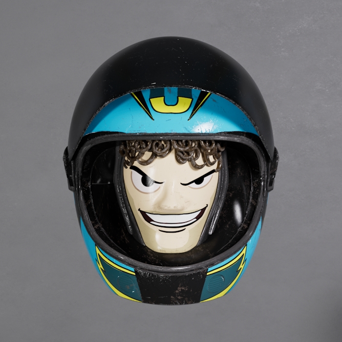 3D rendering of Italian Moto GP legend racer 46 Valentino Rossi's animated character looking straight at the camera, close-up, wearing a helmet. Toy Story style.
