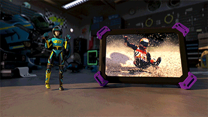 Looping 3D animation of Italian Moto GP legend racer 46 Valentino Rossi's animated character in front of a screen showing his racing highlights. Toy Story style.