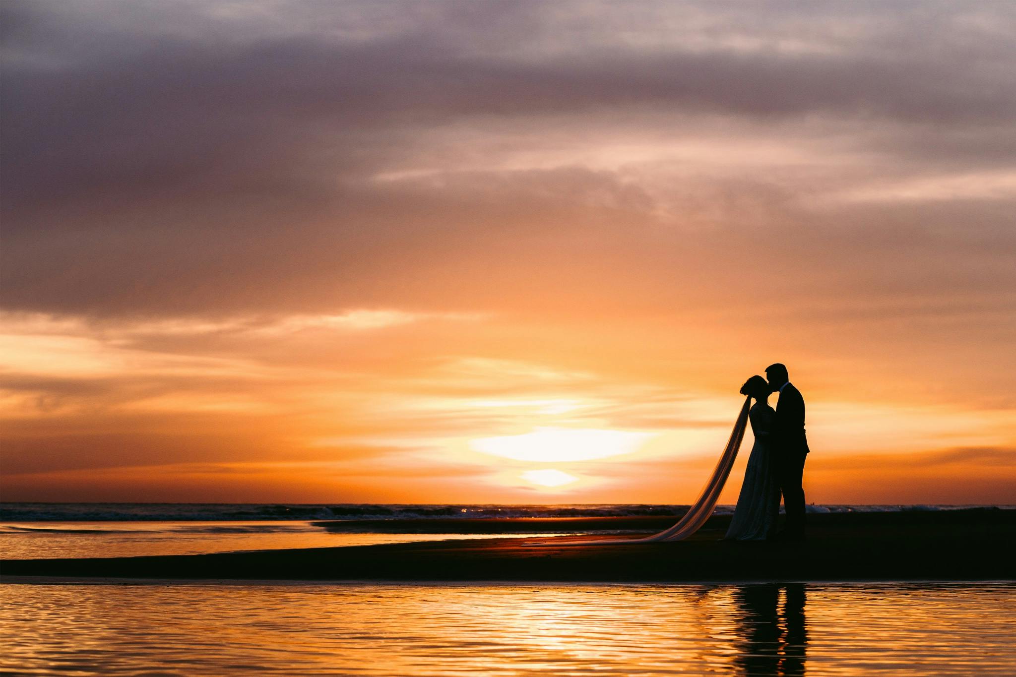 Couple kissing in the sunset