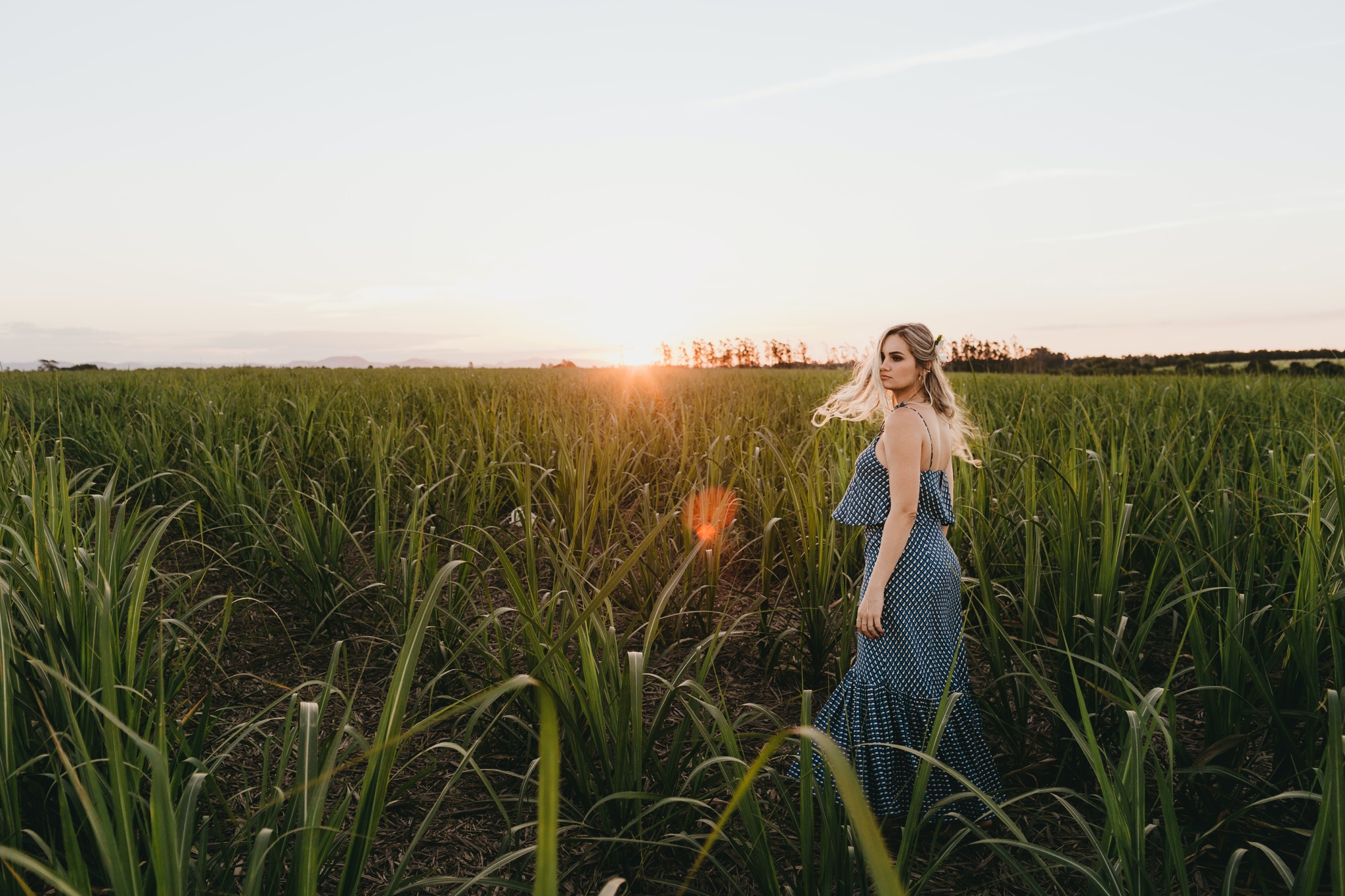 Women in a field during sunset
