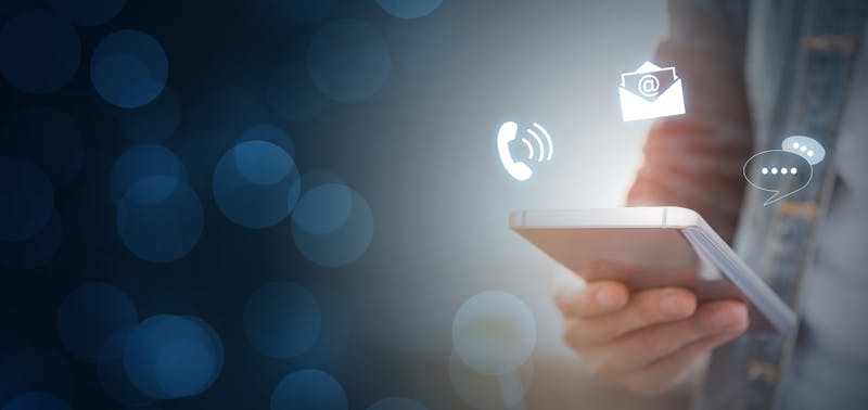 Person holding a mobile phone