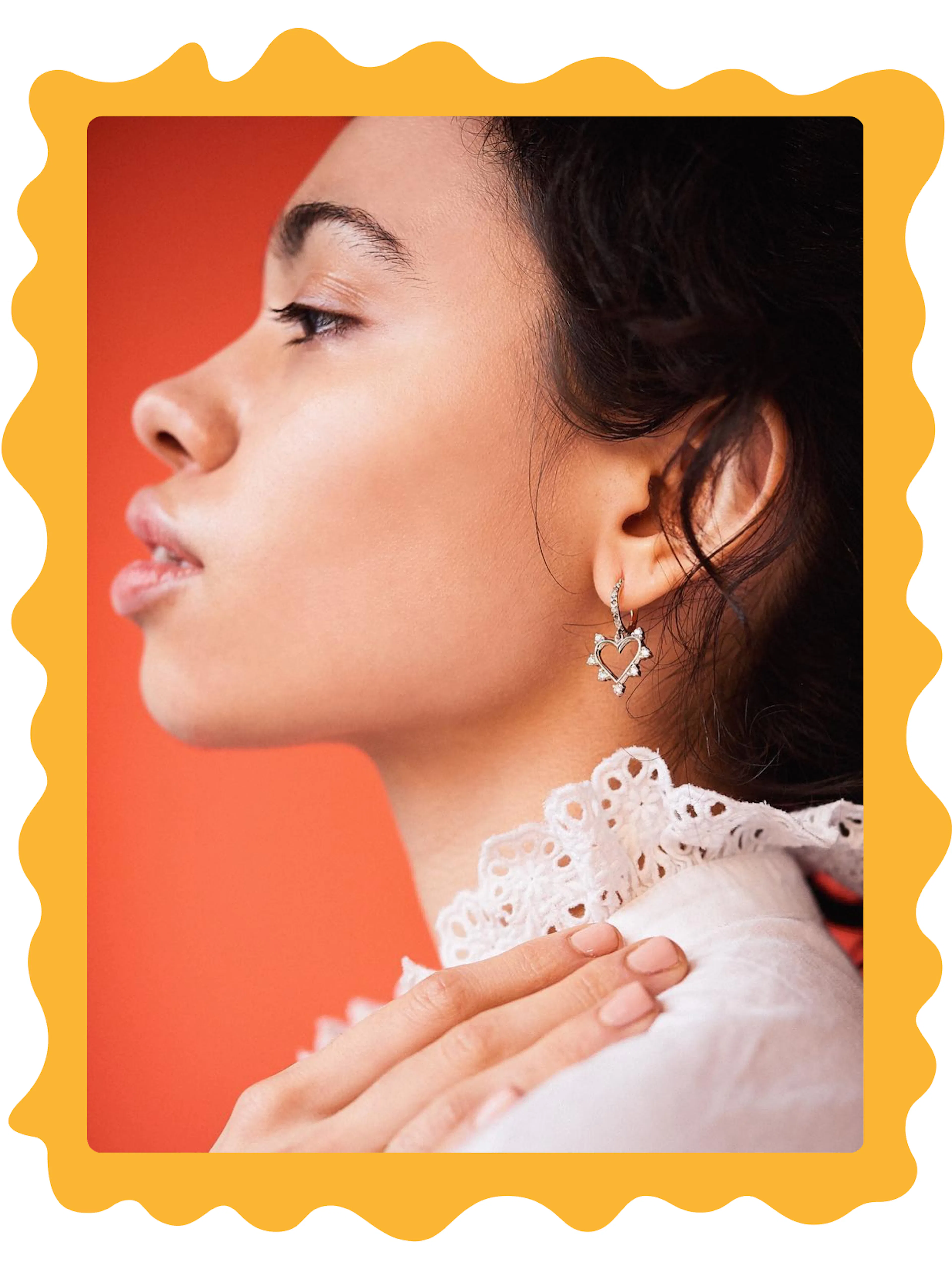 Marlo Laz – Brand Design, E-Commerce, Experience Design "A luxury shopping voyage": Photo showing a woman's profile wearing a heart-shaped earring and a white lace collar x HY.AM Studios