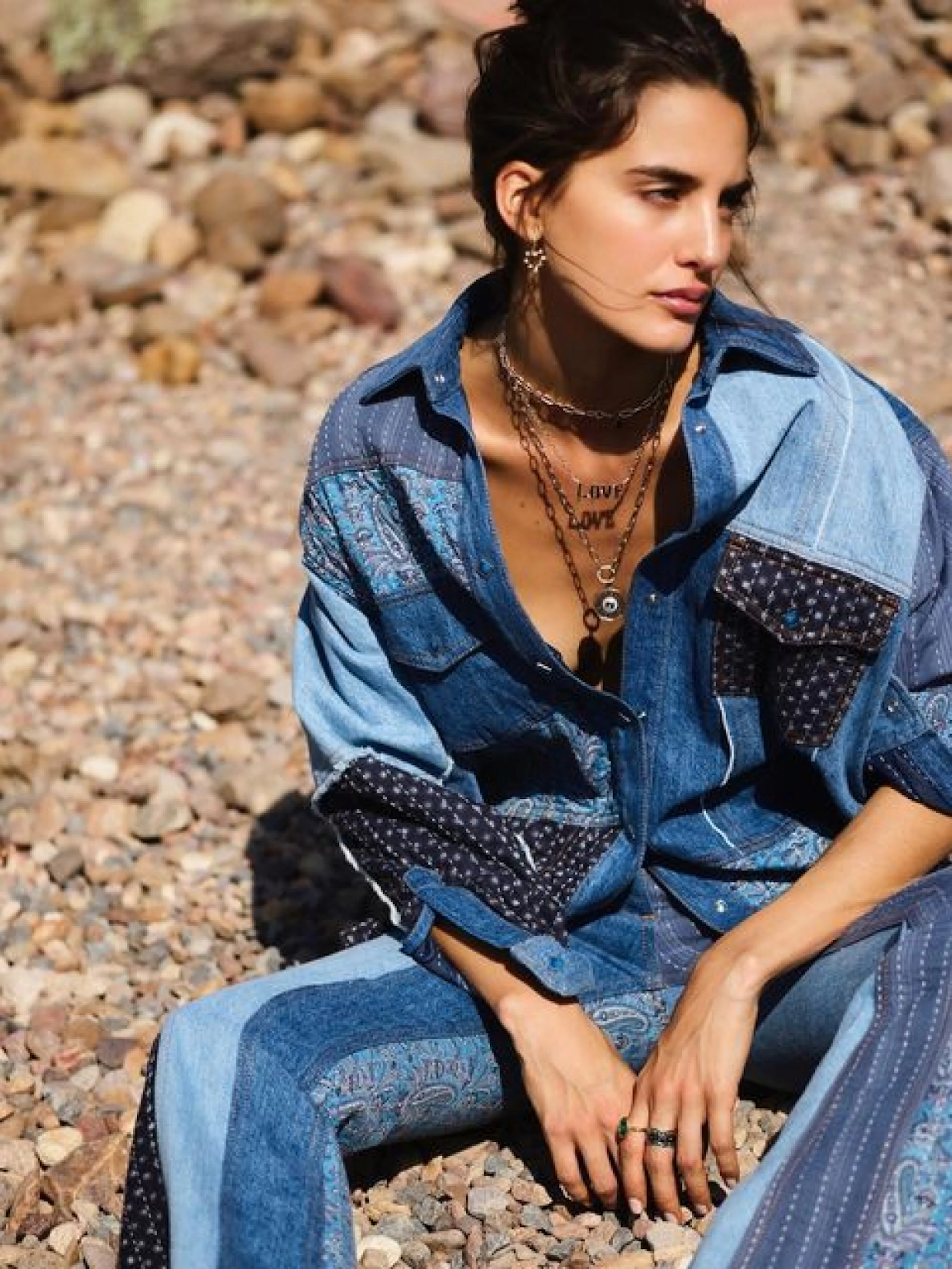 Marlo Laz – Brand Design, E-Commerce, Experience Design "A luxury shopping voyage": Photo showing a woman wearing a patchwork denim shirt and pants, adorned with layered necklaces x HY.AM Studios
