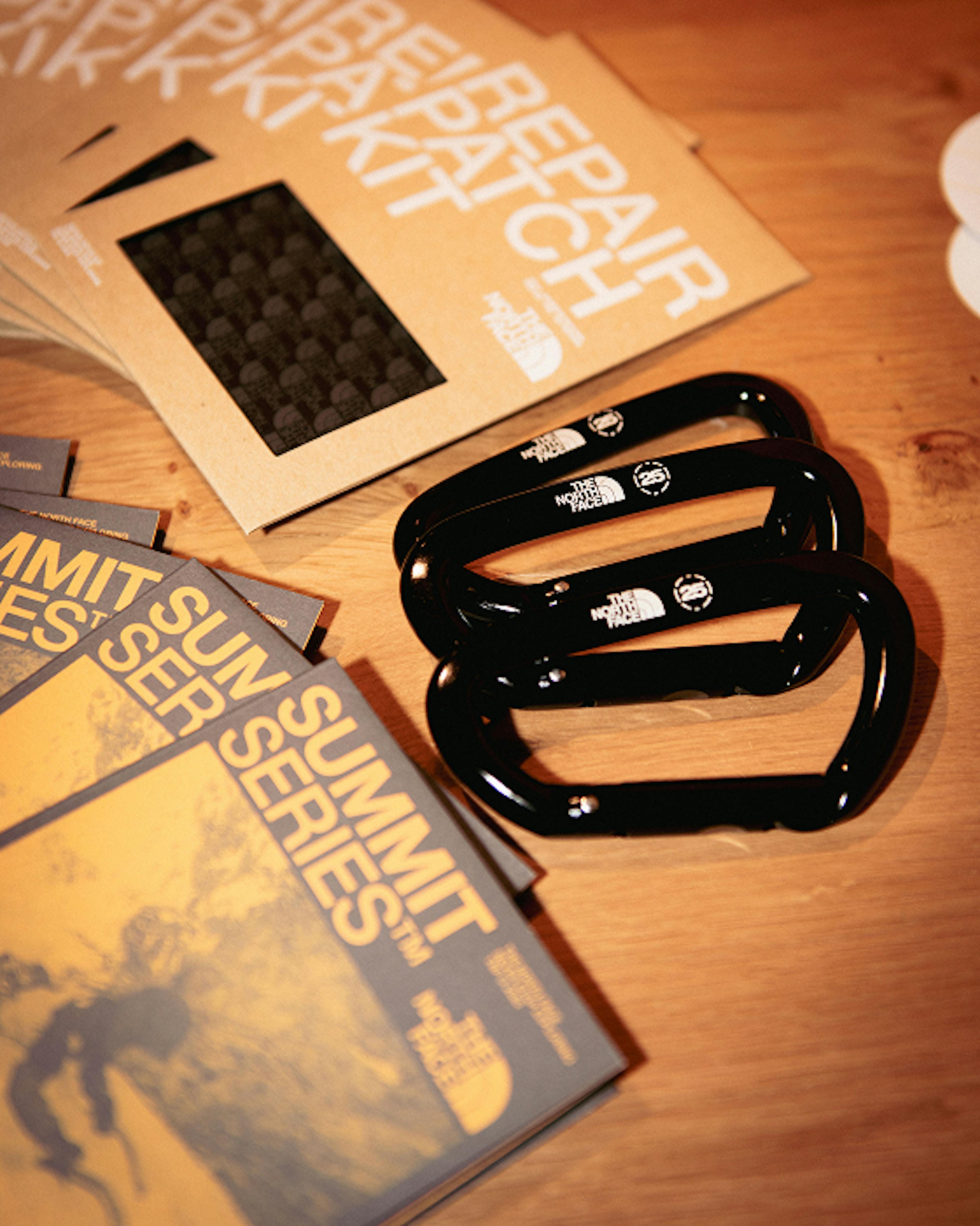 The North Face – Brand Activation "Summit Series Brand Activation": Photo showing The North Face Summit Series branding, repair kits, and carabiners on a wooden surface x HY.AM Studios