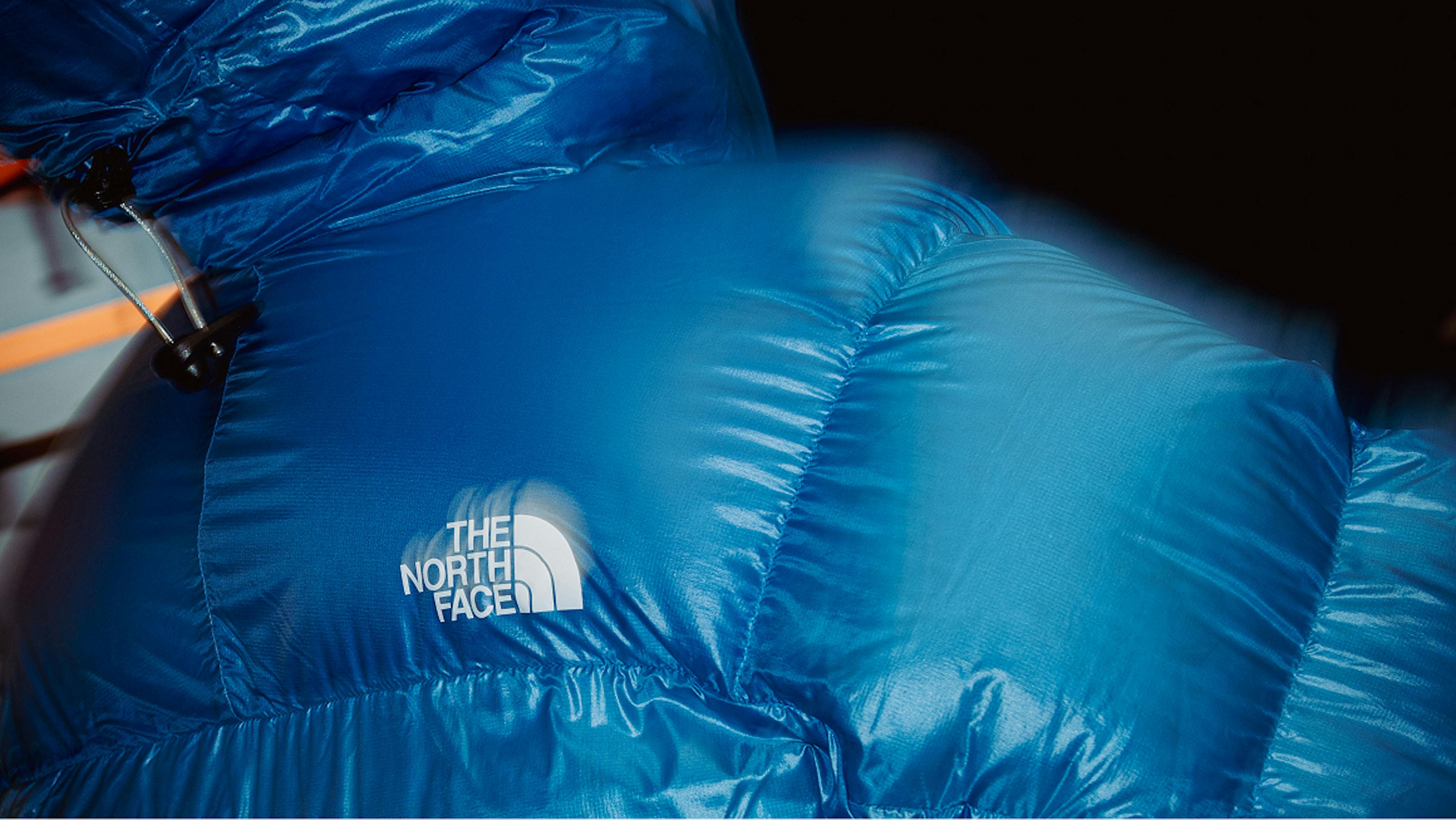 The North Face Summit Series brand activation on blue puffer jacket