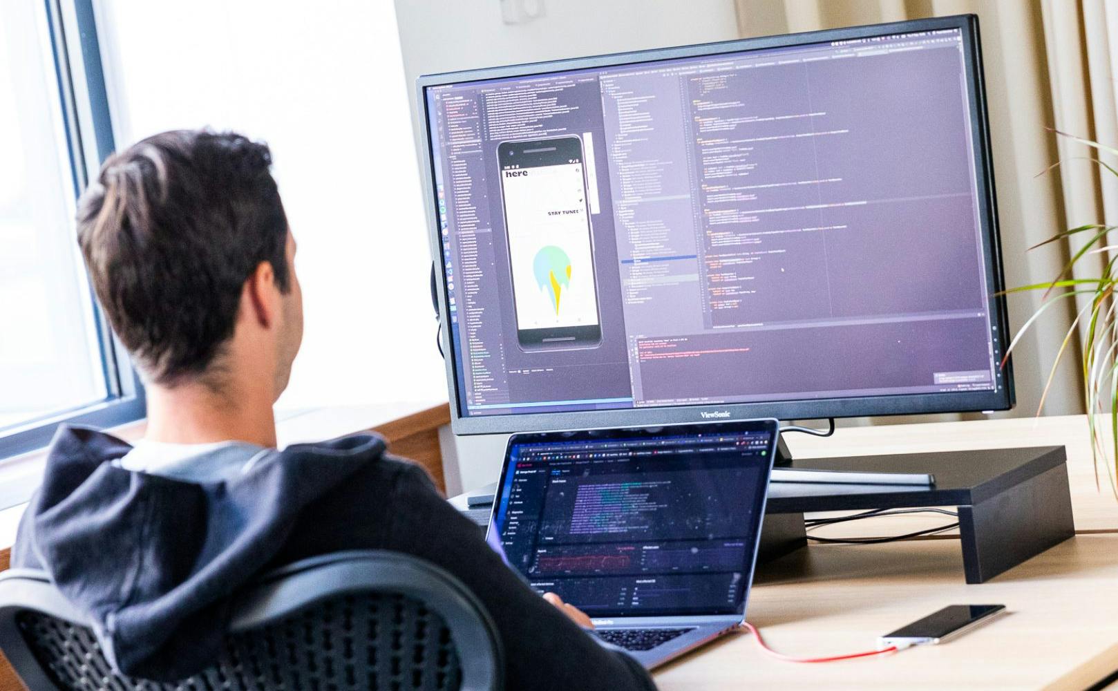 Developer sitting in front of a computer