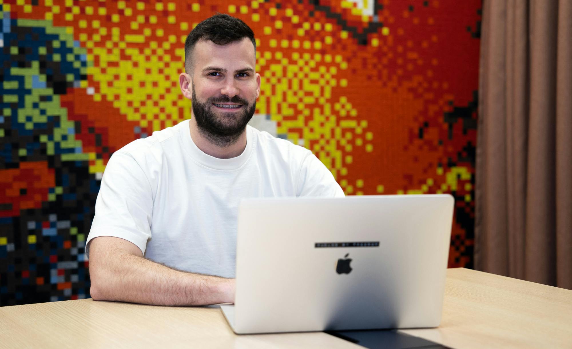 Jan Hauser, CEO of Applifting UK, sitting at a laptop