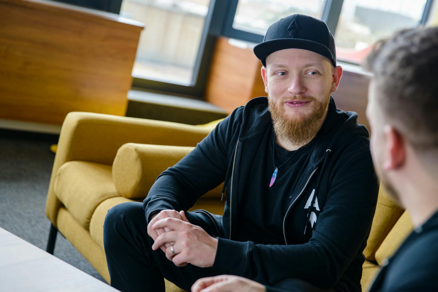 CEO of the company posing on a sofa