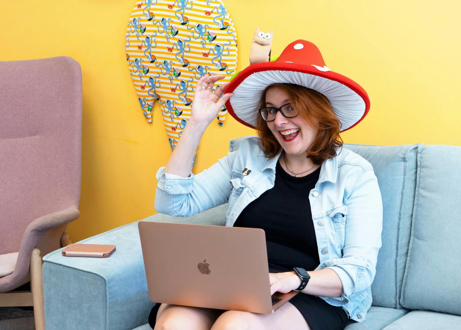 HR leader laughing and posing with a laptop