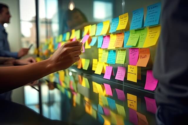 feature planning meeting with post it board for web app project