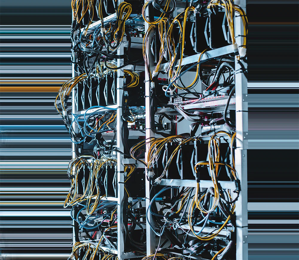 image of computer servers in a data center covered in wires and inputs