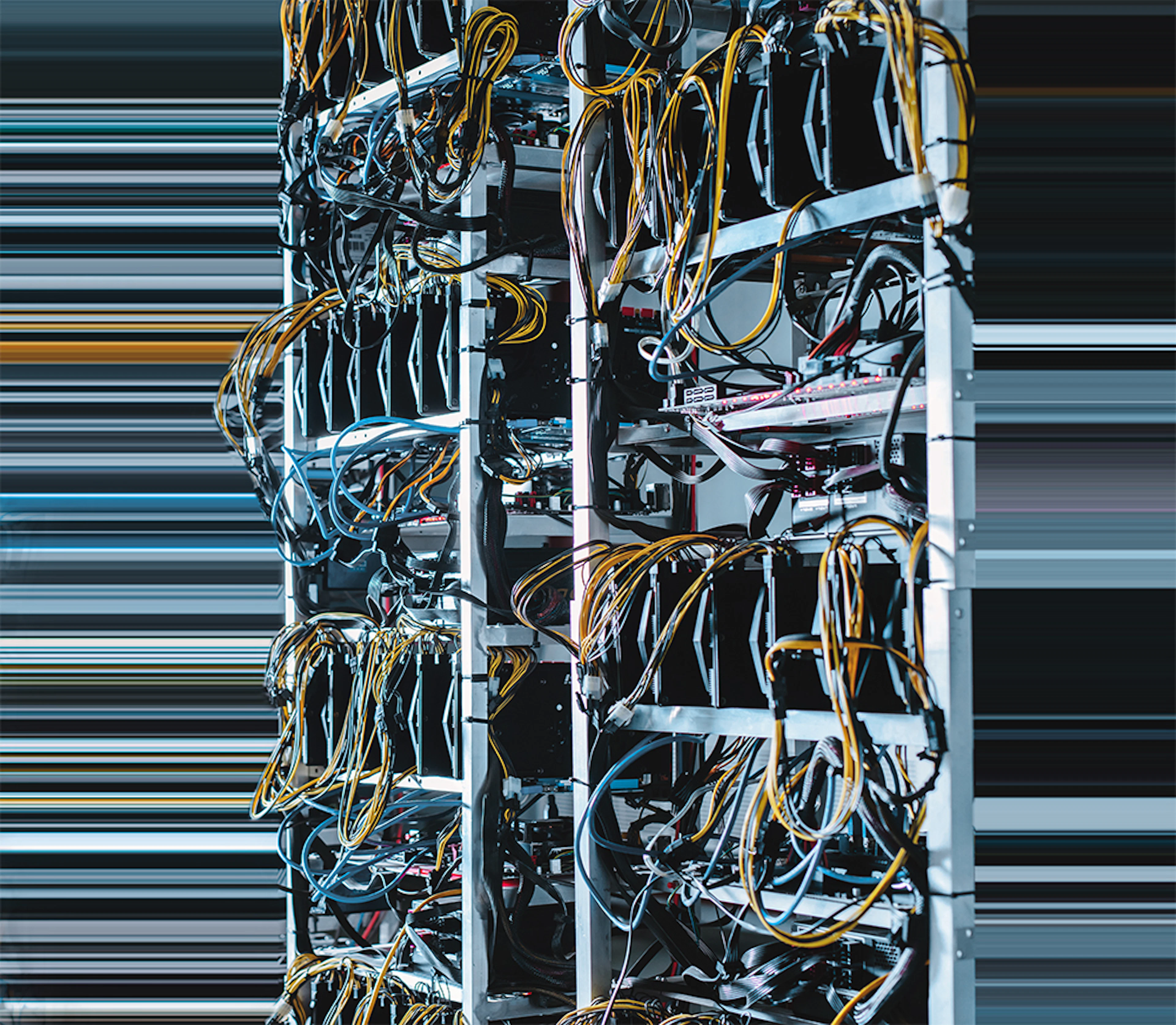 image of computer servers in a data center covered in wires and inputs