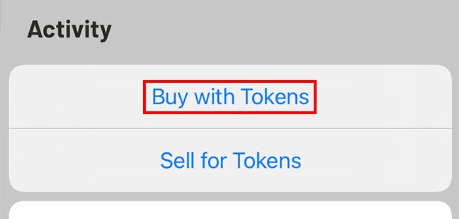 Tap 'Buy with Tokens'