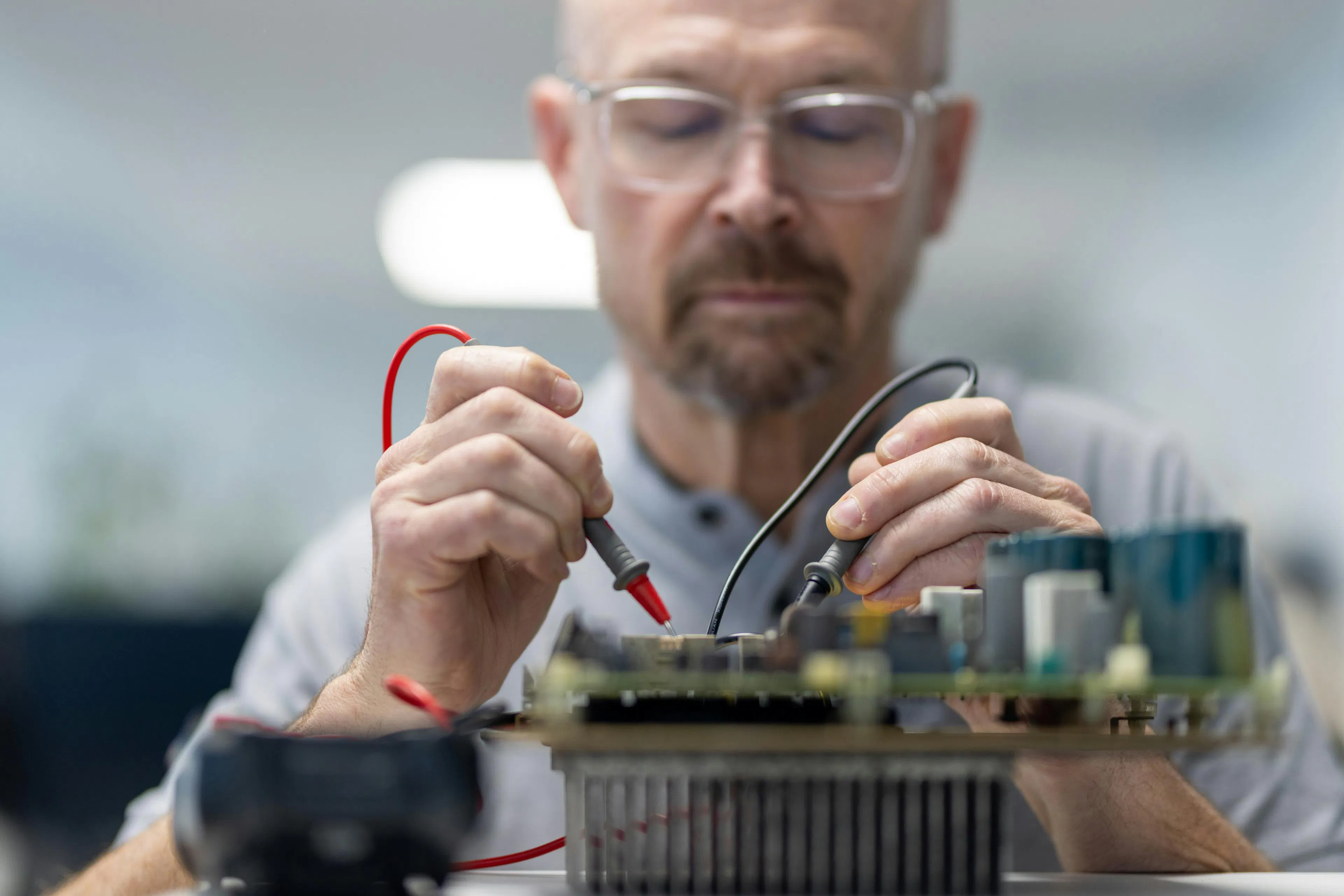 A factotum technician repairing an electronic device