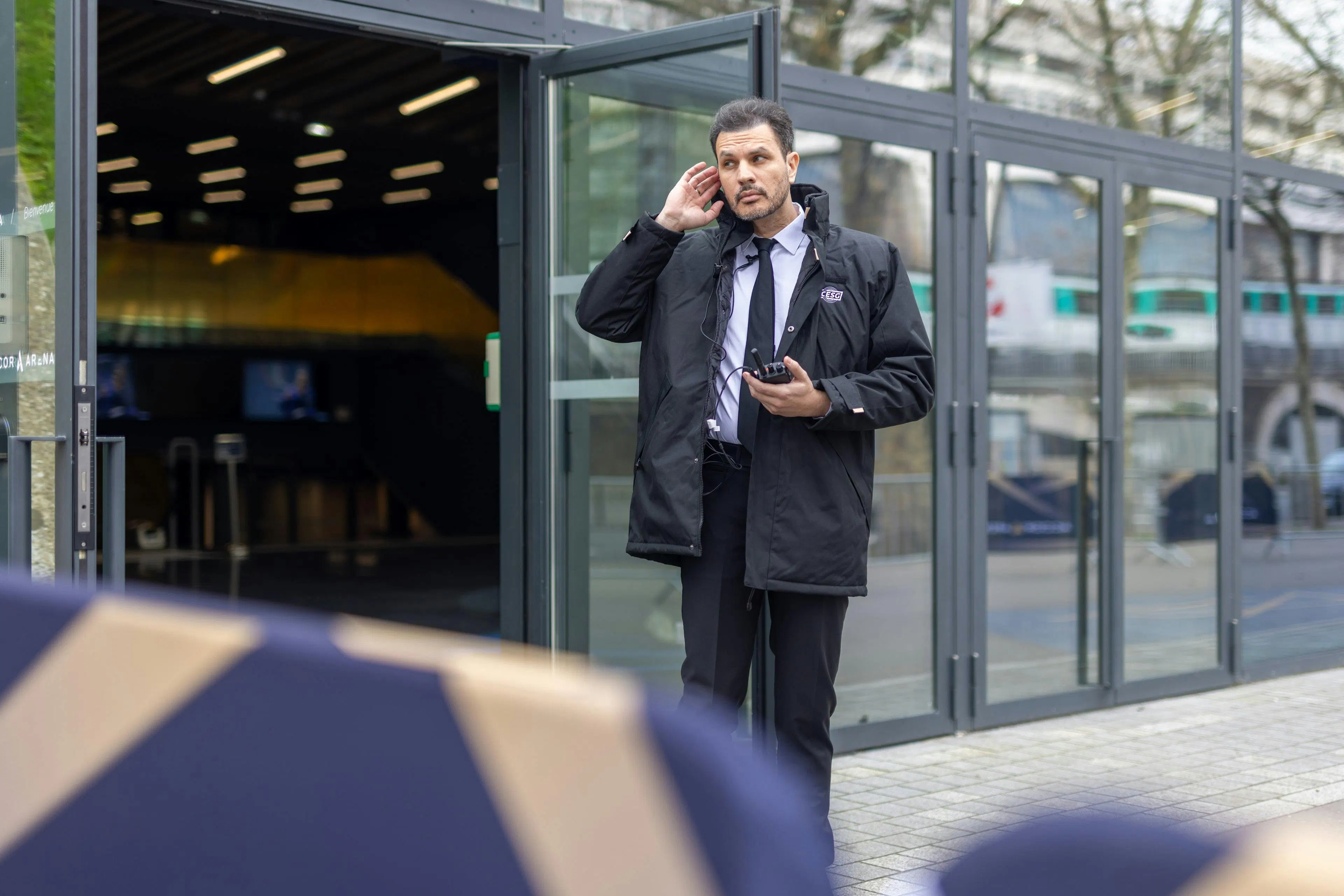 A security guard securing a venue at the entrance of an event site