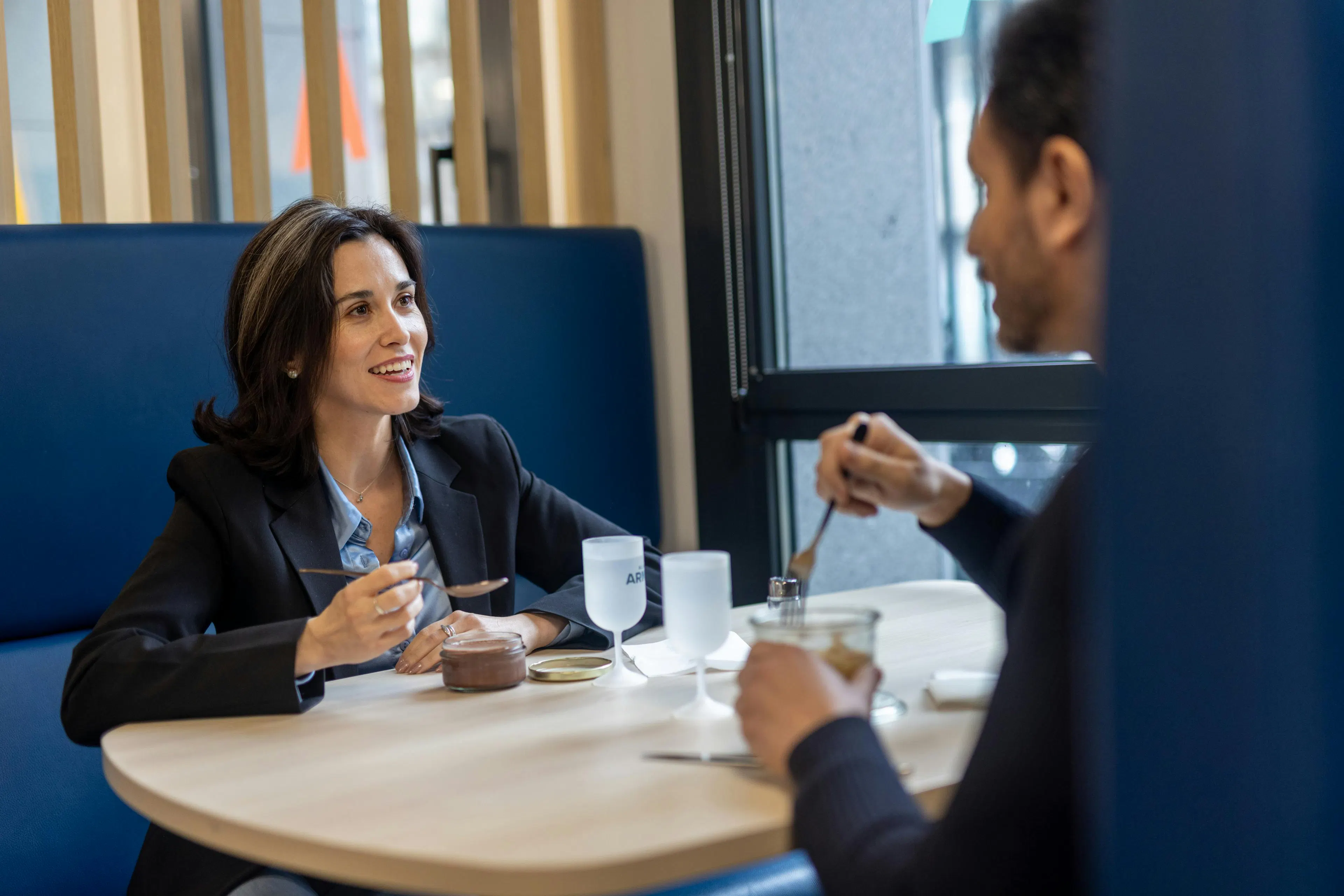 Two colleagues having lunch together in a work environment