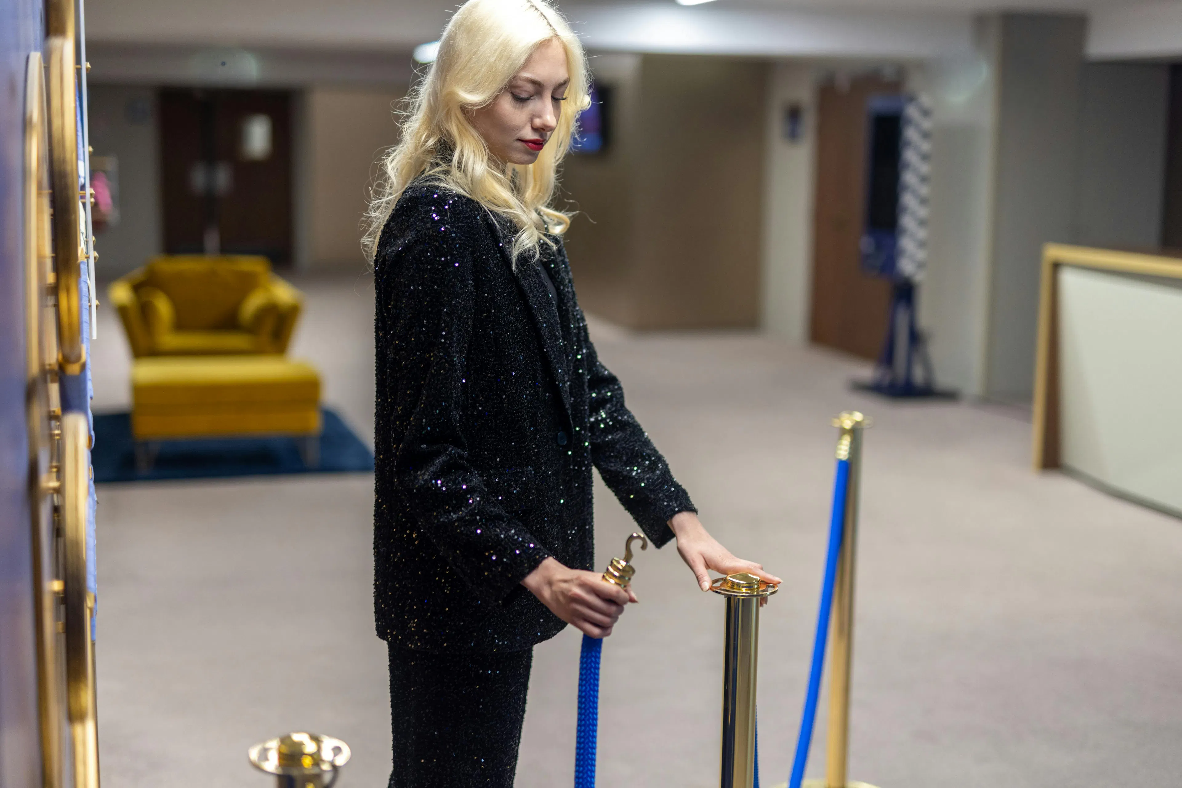 A hostess arranging a space at an event venue
