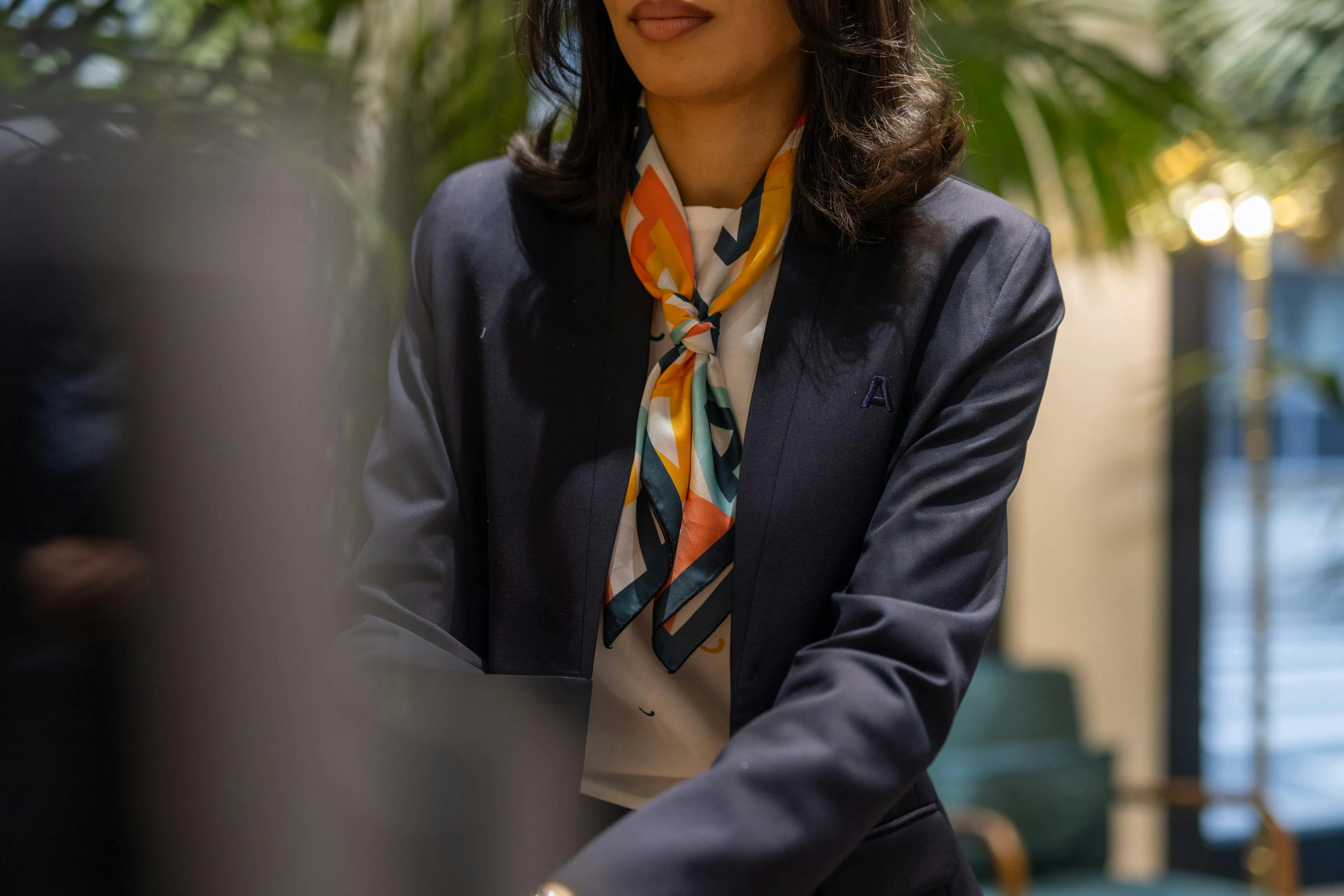 A close-up of the receptionist's uniform
