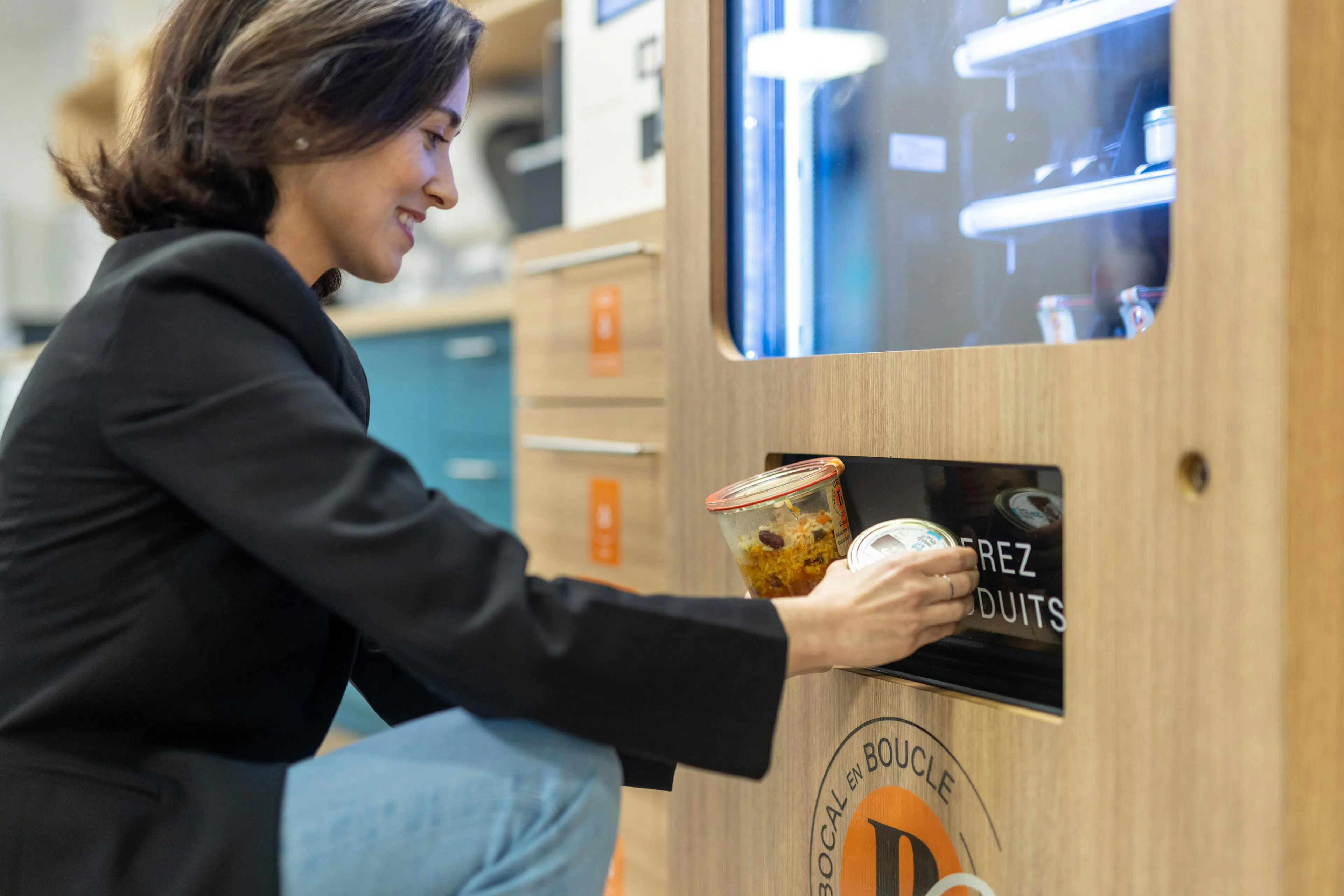 An employee retrieving her meal