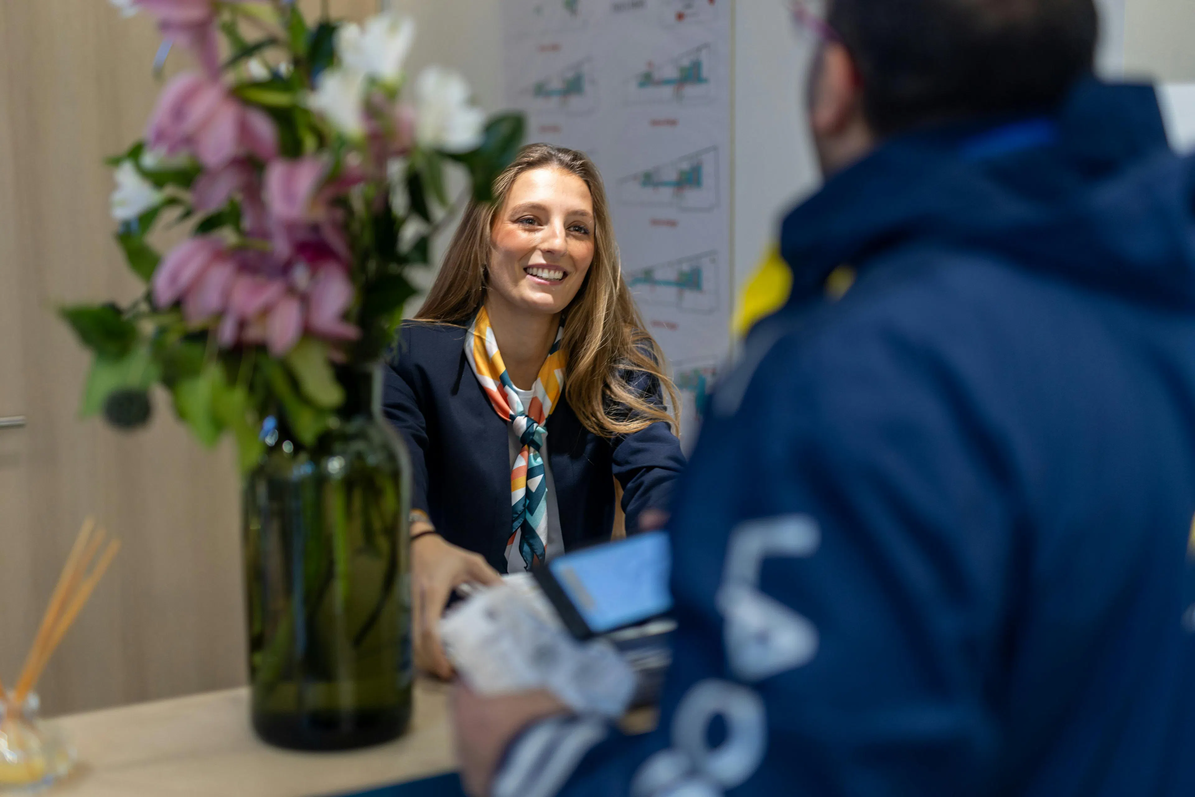 A receptionist receiving mail