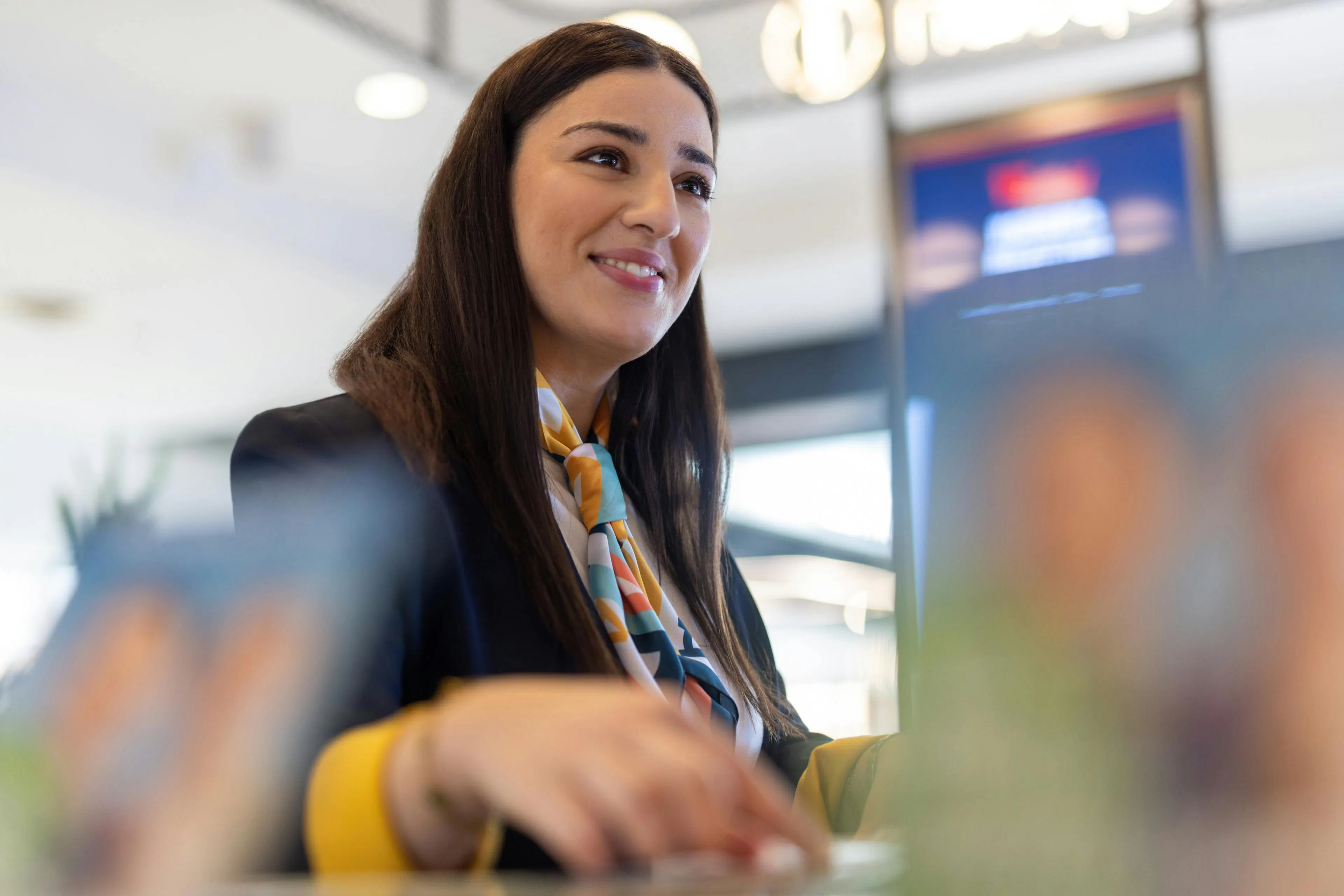 A hostess welcoming customers in a store
