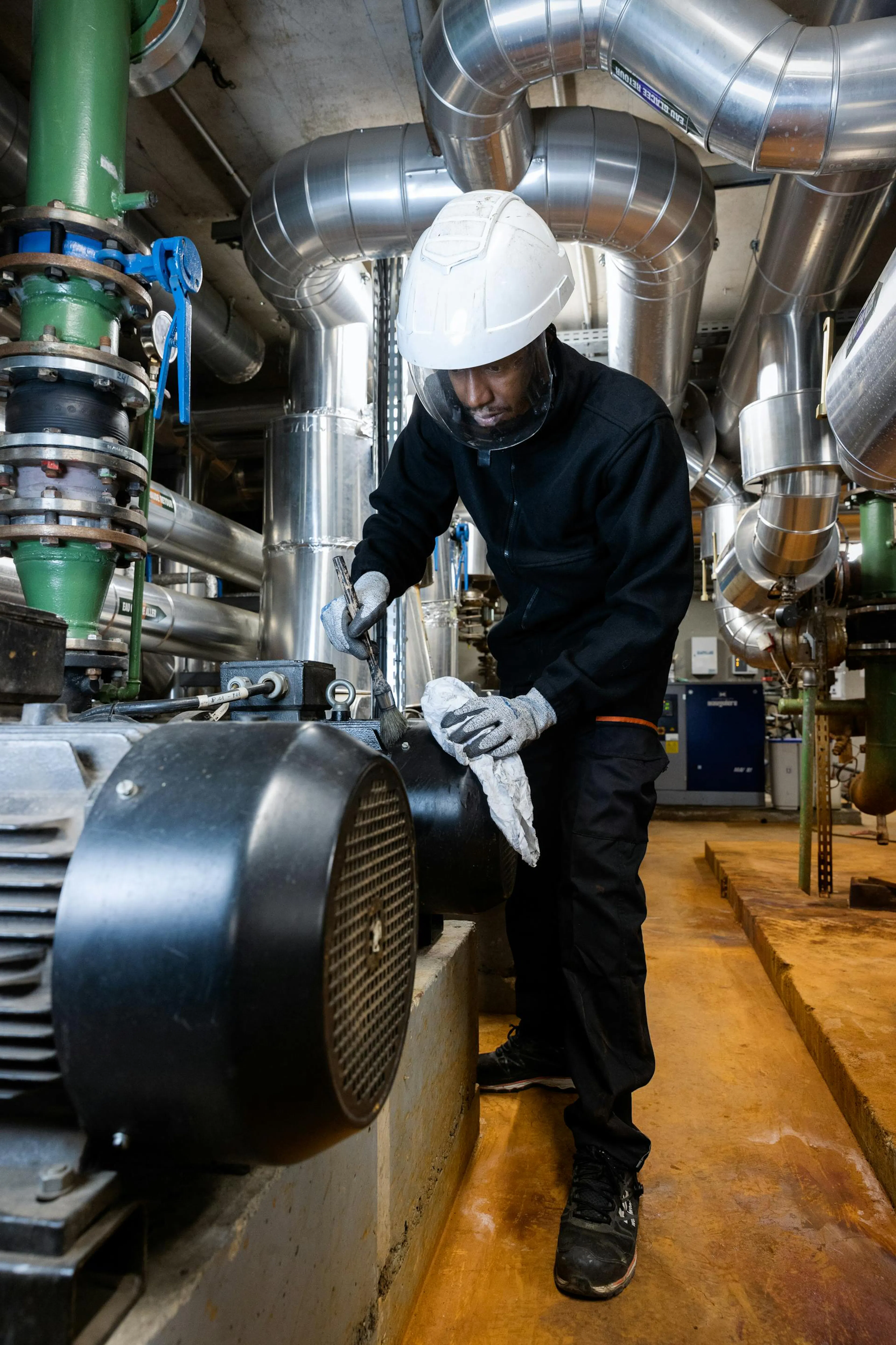 Technician working on mechanical building installations.