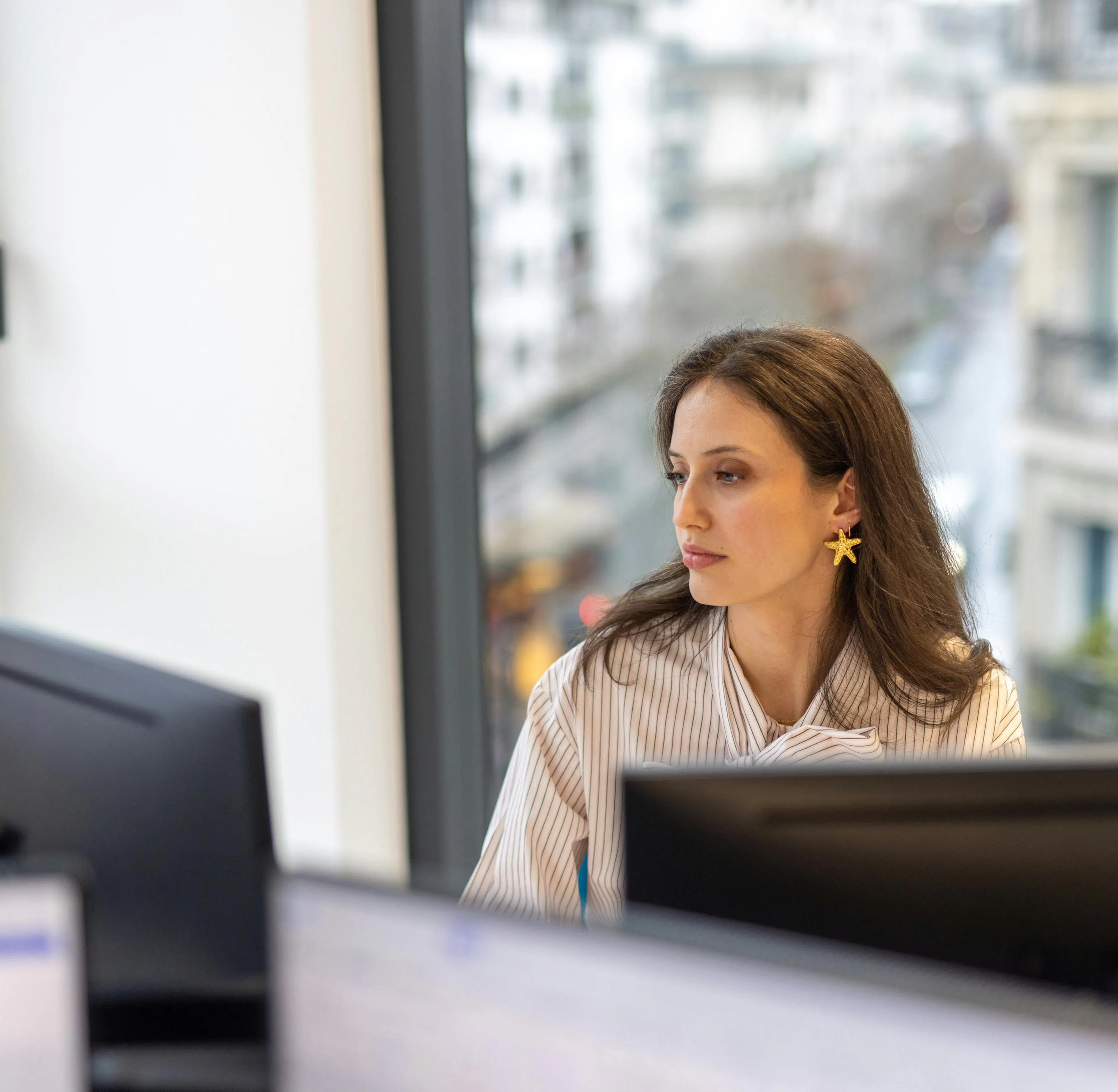 A reception hostess working on her computer