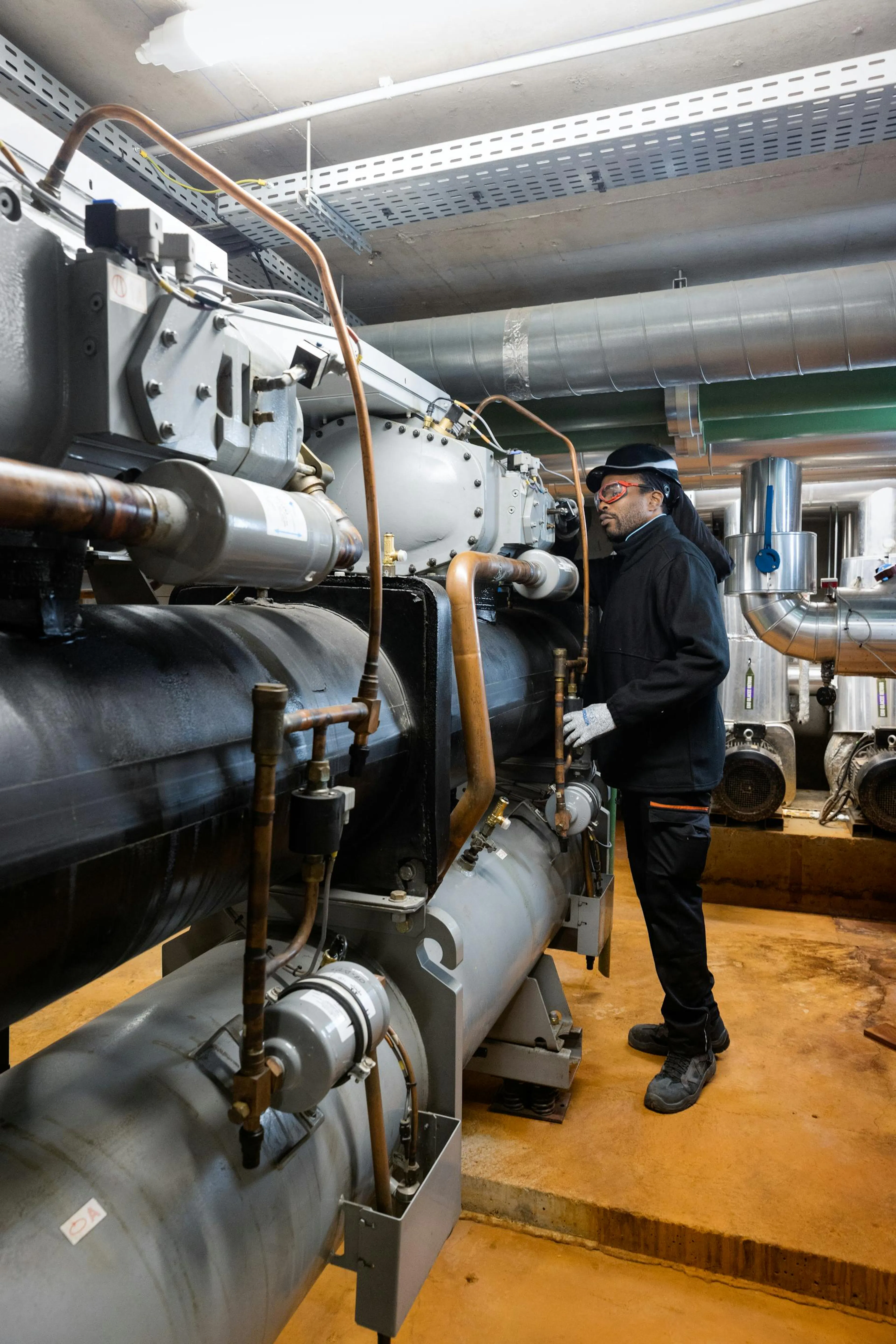 Technician working in a technical plant room