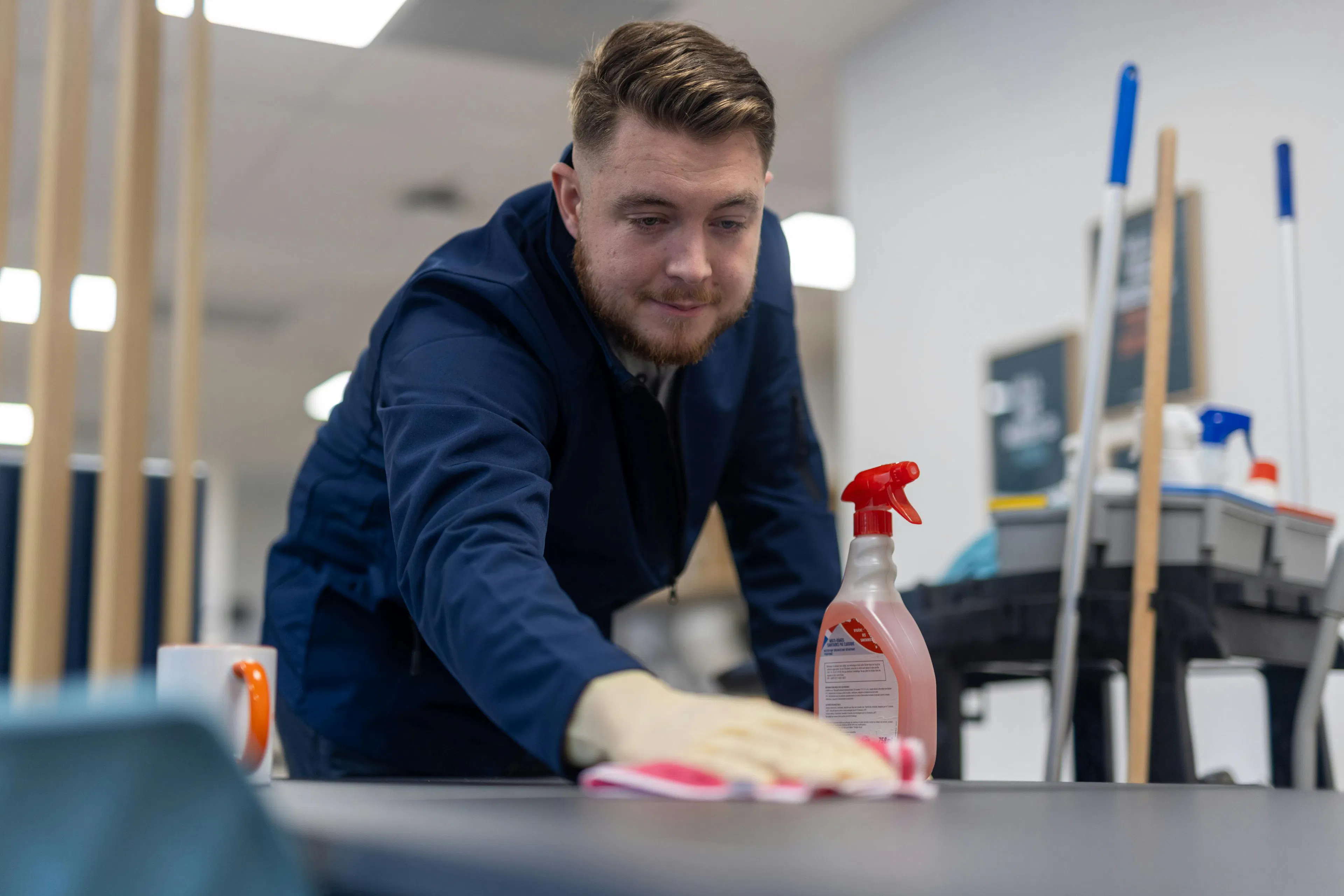 Professional cleaner cleaning a work surface