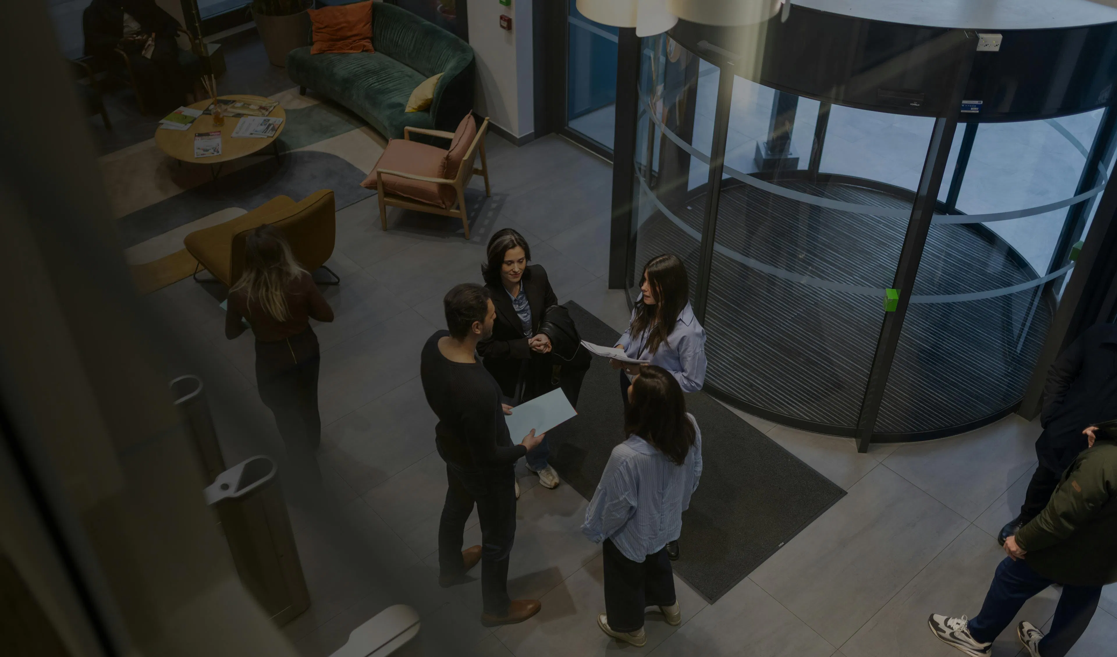 Four employees talking together