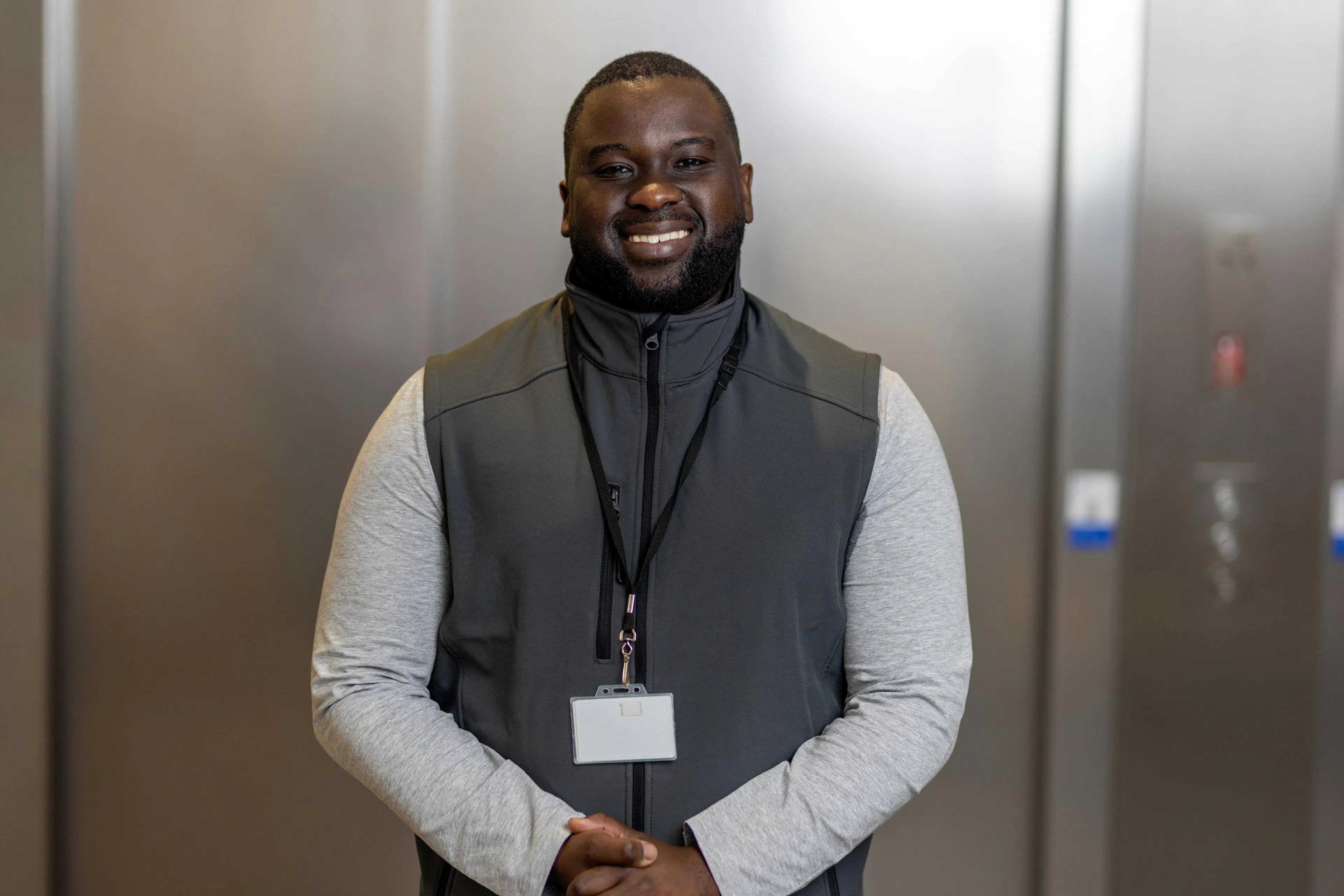 A smiling maintenance technician