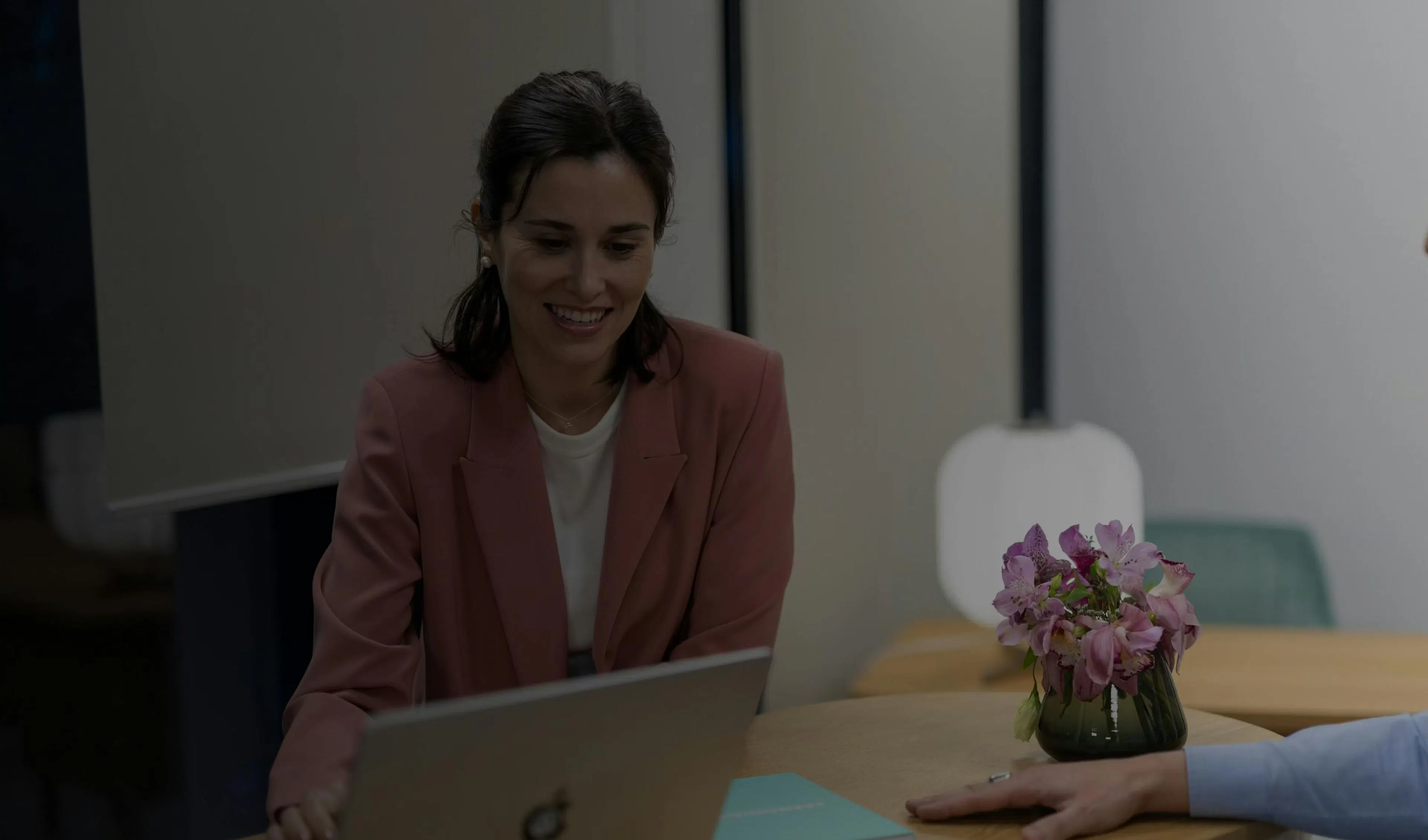 A team member looking at her computer