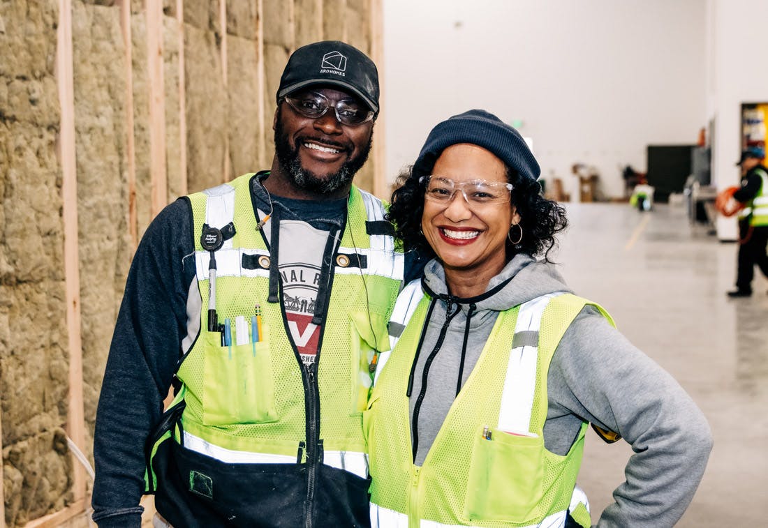 2 workers smiling